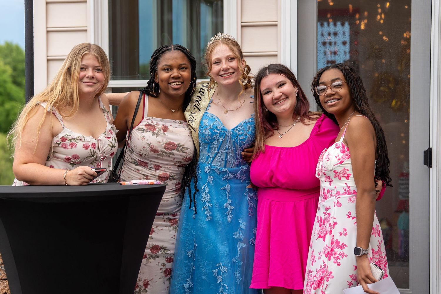 Five young women smiling together outdoors at a Sweet Sixteen birthday party celebration.
In Forest Hill Maryland