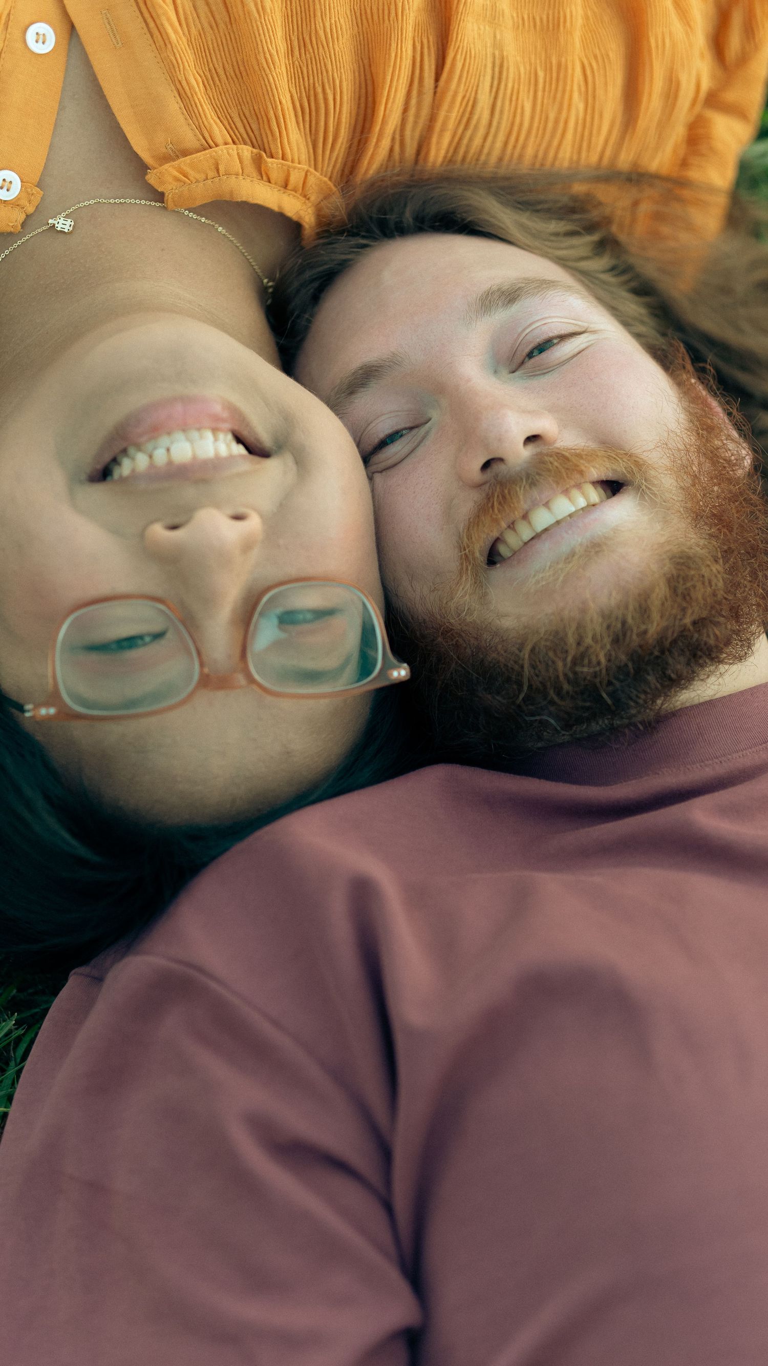 Couple smiling at camera during their engagement session In Joppa Maryland Jerusalem mill