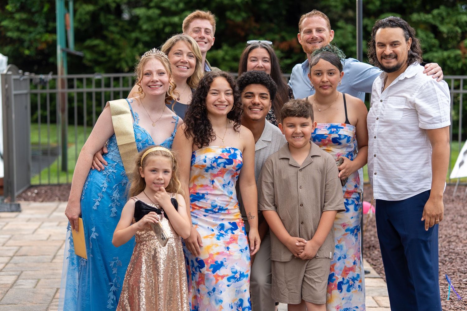 Group of ten people including teens and adults smiling together outdoors at birthday celebration.
In Forest Hill Maryland