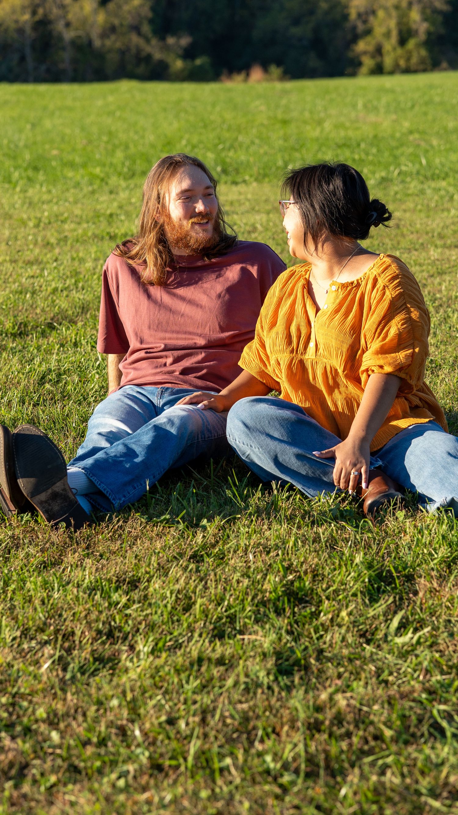 Happy Couple looking at each other during their  Engagement photoshoot at Jerusalem Mill in Joppa Maryland
