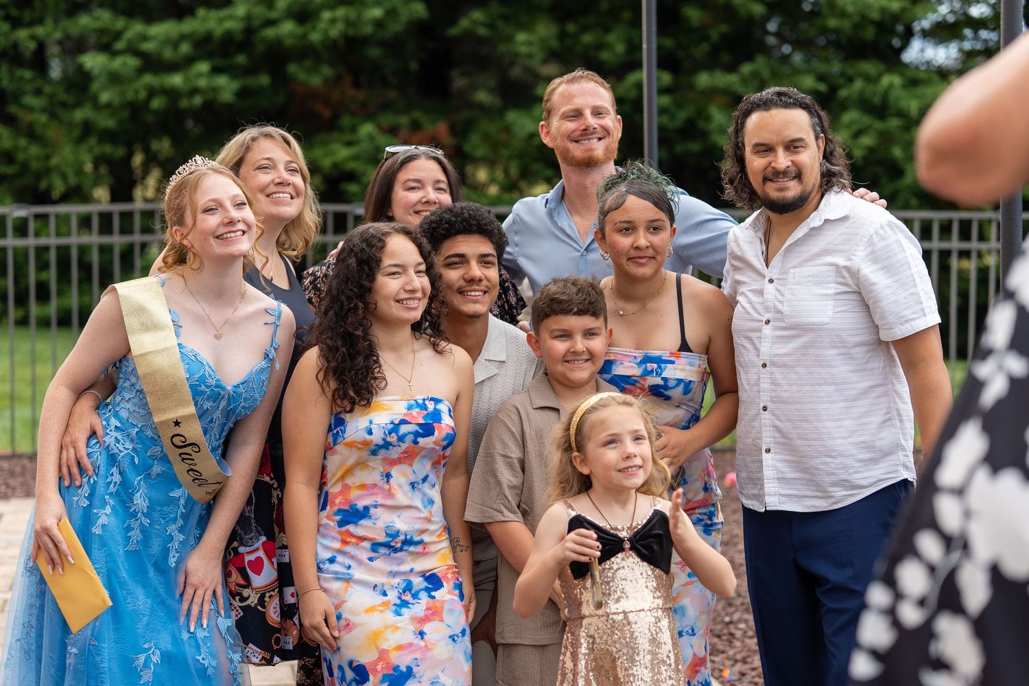 Large group of teens and adults posing together outdoors at a Sweet Sixteen birthday celebration.
In Forest Hill Maryland