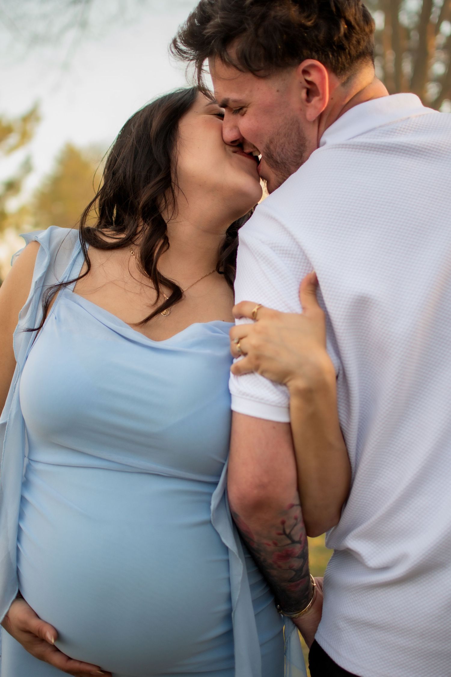 Intimate and clean portrait capturing a couple's kiss at Hall County Park in Grand Island, Nebraska.