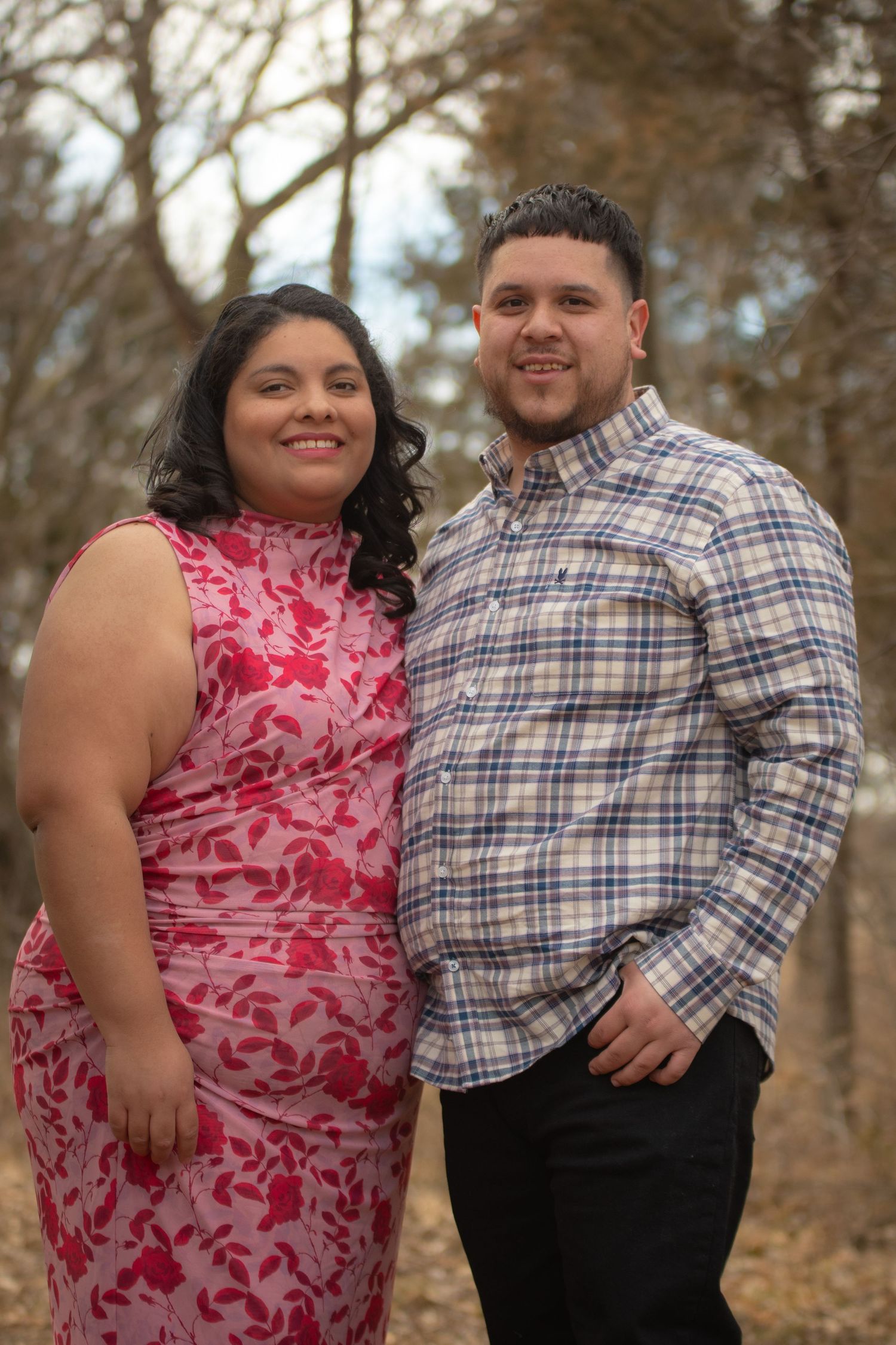 Vibrant park portrait of a smiling couple in patterned formal attire near Grand Island, NE.