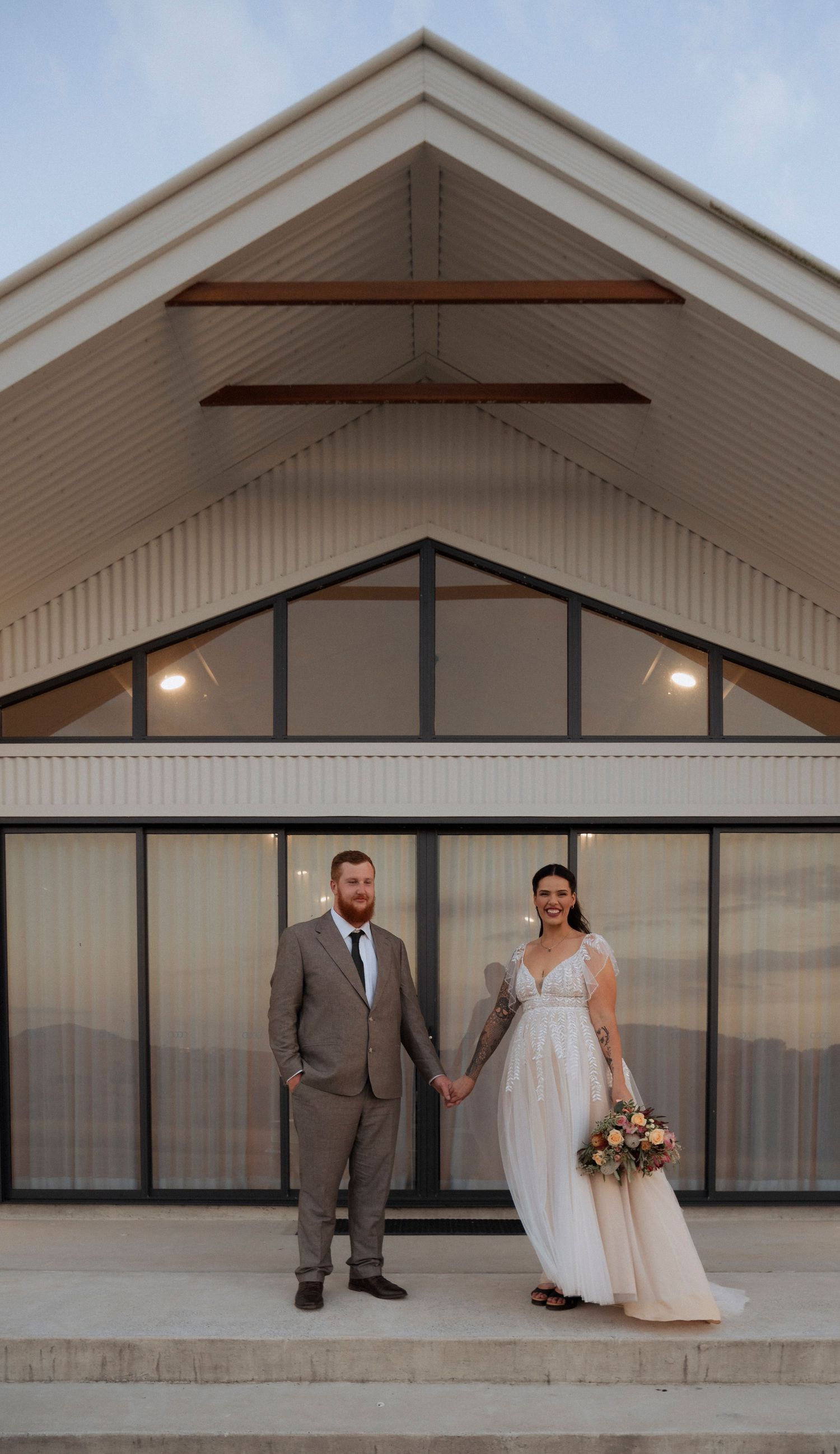 Wedding portraits captured outside the modern architecture at Maroon Hill Estate.