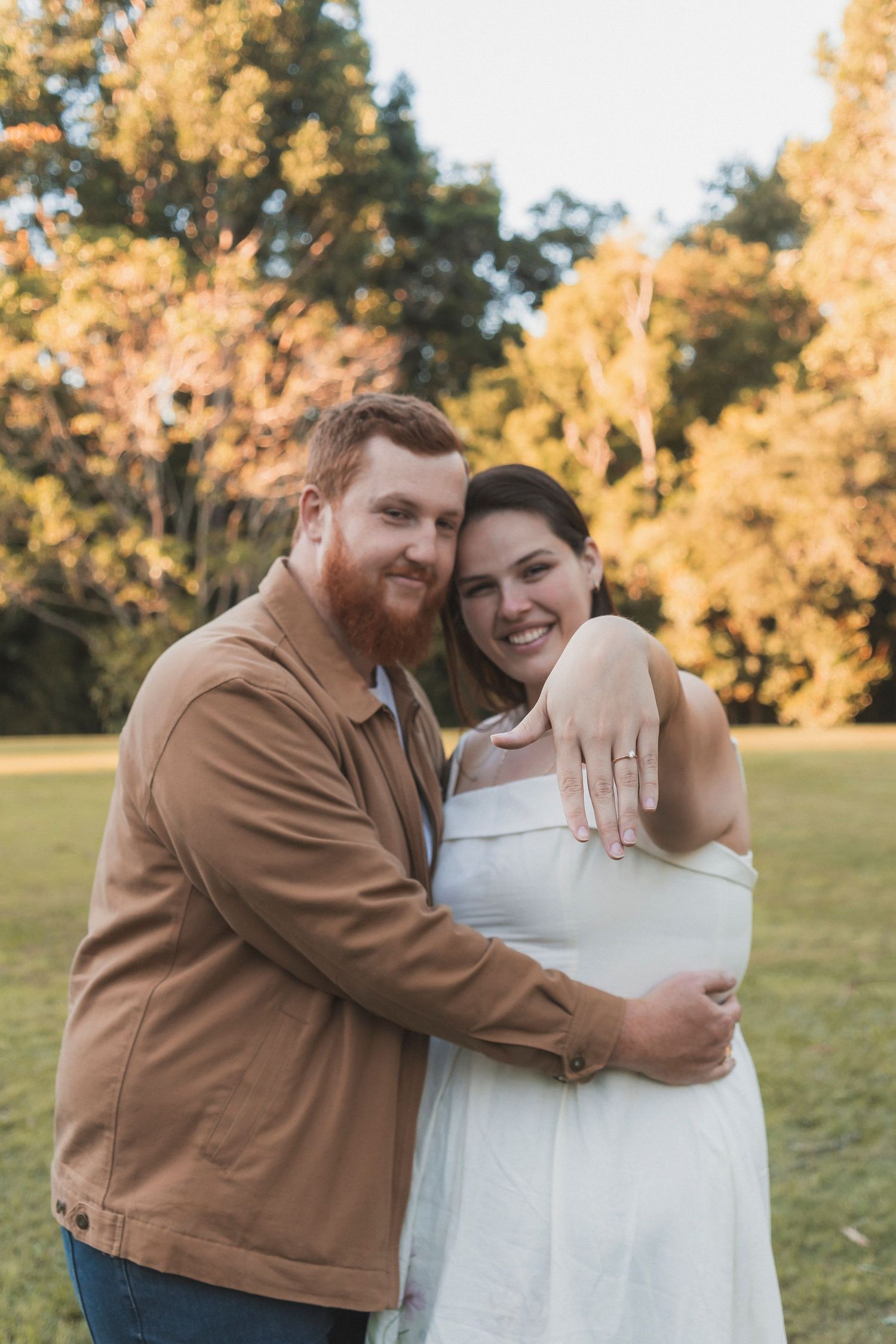 Newly engaged couple showing off ring in Kholo Gardens, Ipswich South East Queensland. Candid, a documentary style photography.