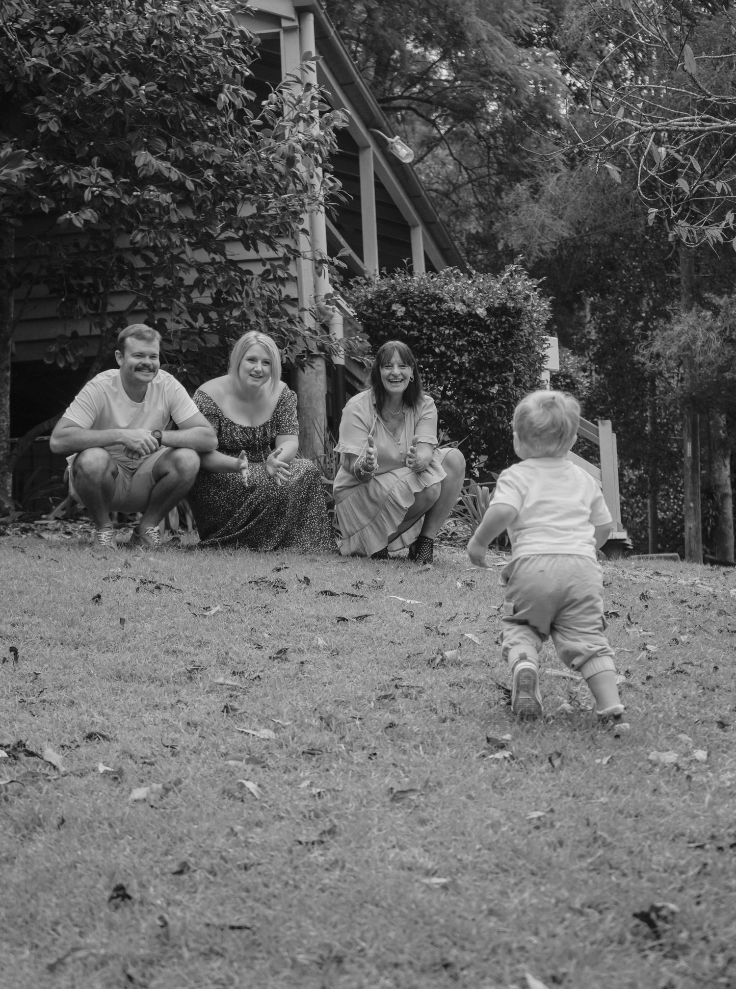 Toddler running towards family during Toowoomba family photos, Spring Bluff train station photographed by Shae Imagery Toowoomba
