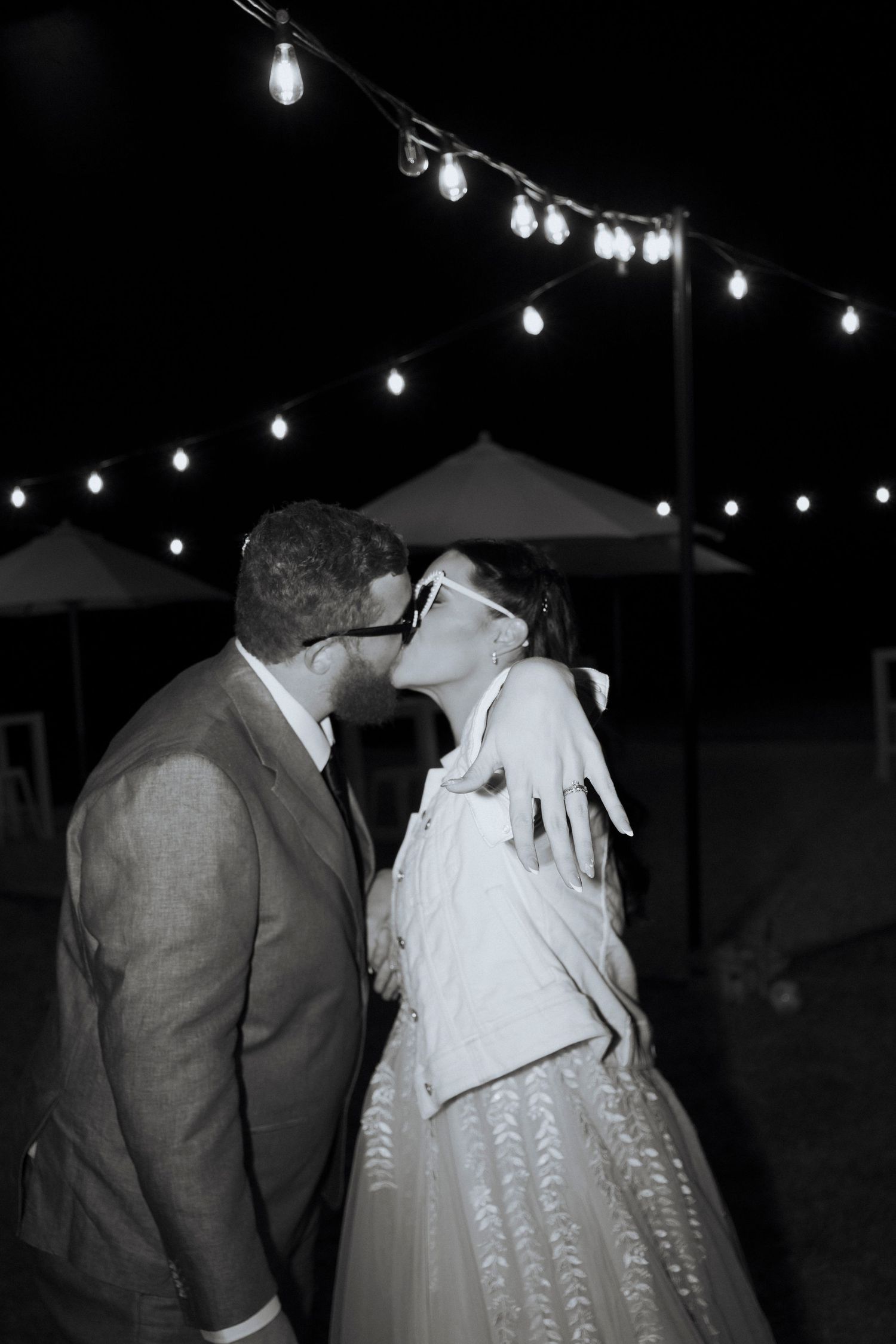 bride and groom under the festoon lights direct flash photography editorial style photography at maroon hill estate recommend photographer