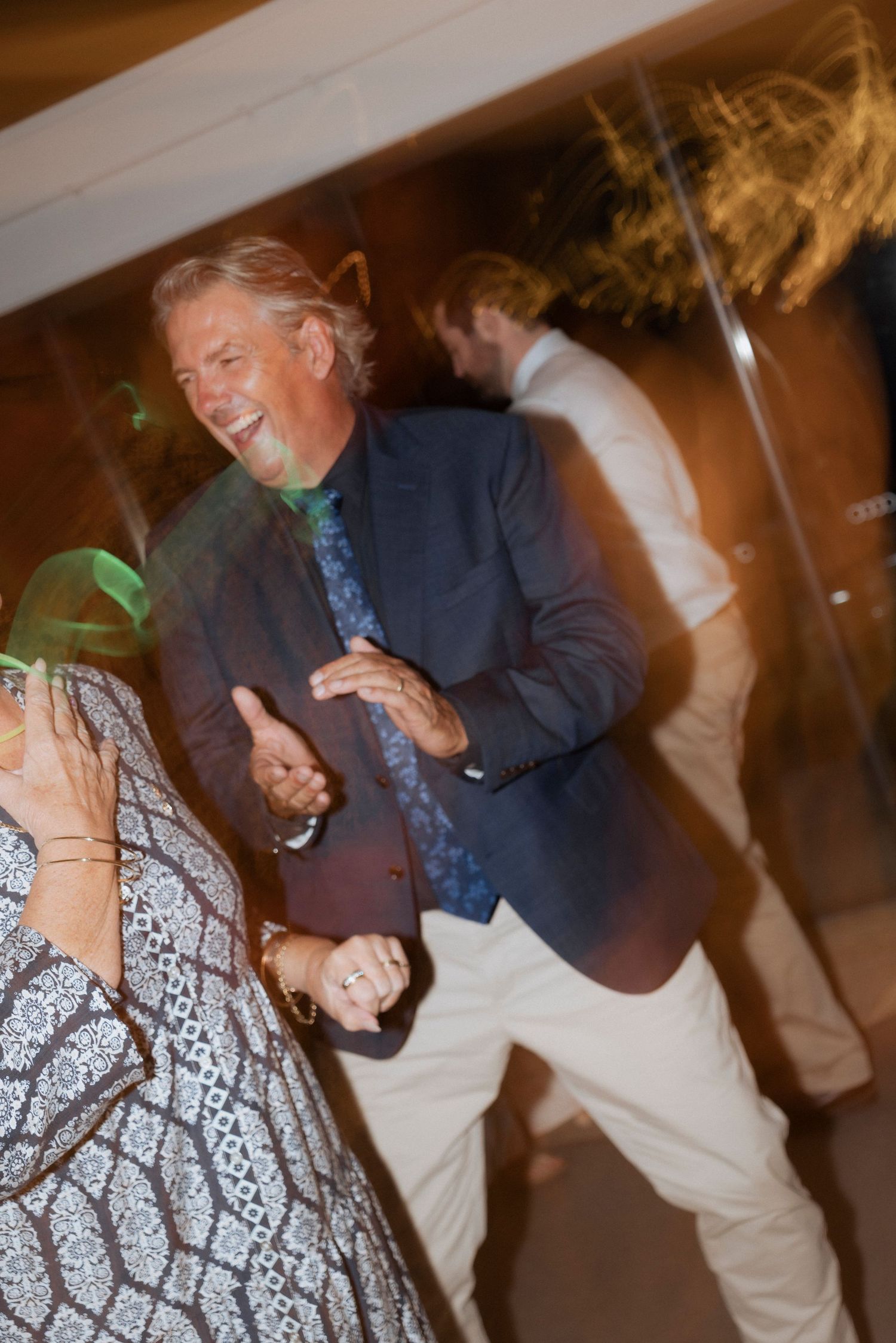 Candid wedding reception photo capturing the energy of the dance floor.