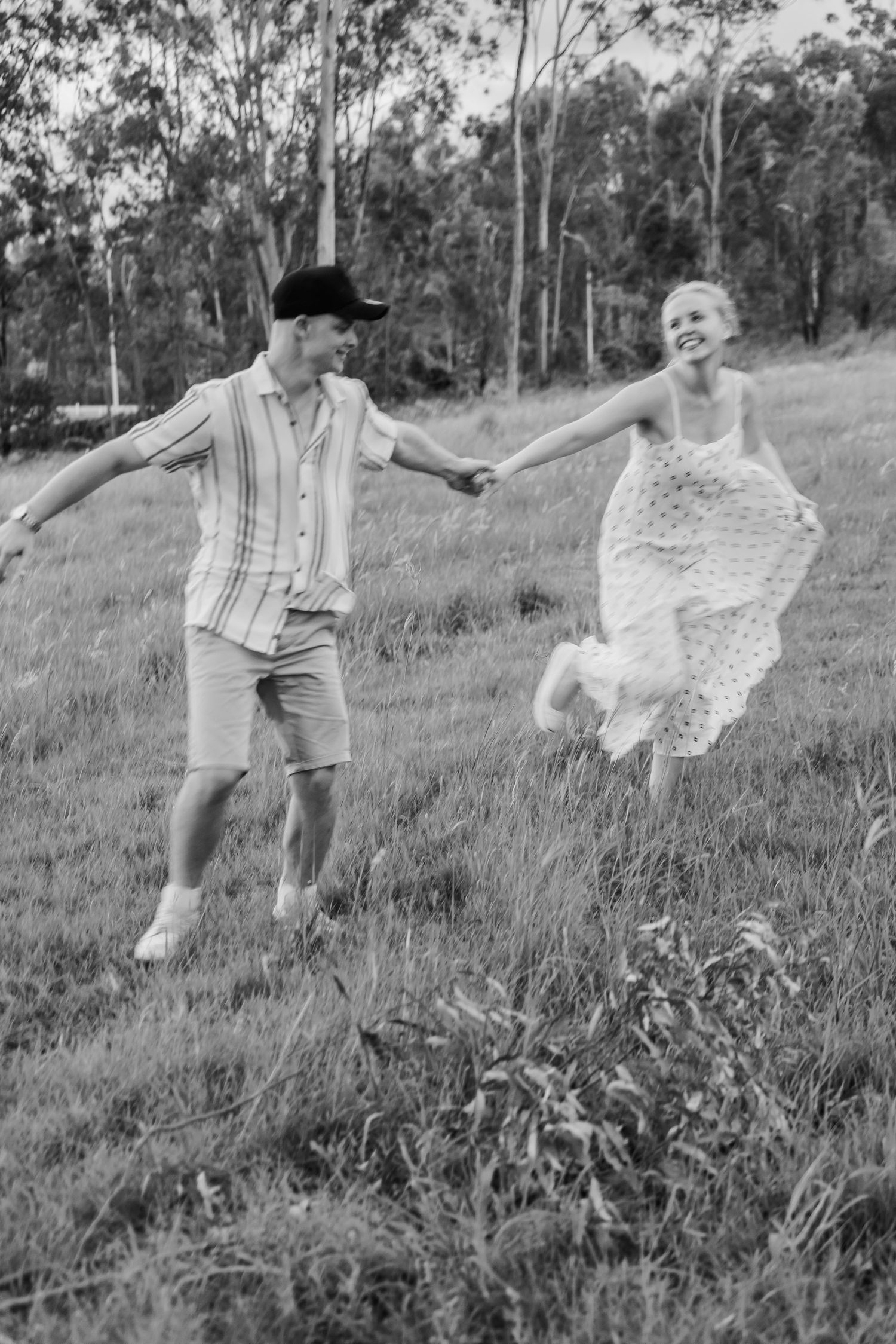 Engaged couple laughing during golden hour session in Lockyer Valley. editorial engagement. Photos are free with Wedding boo