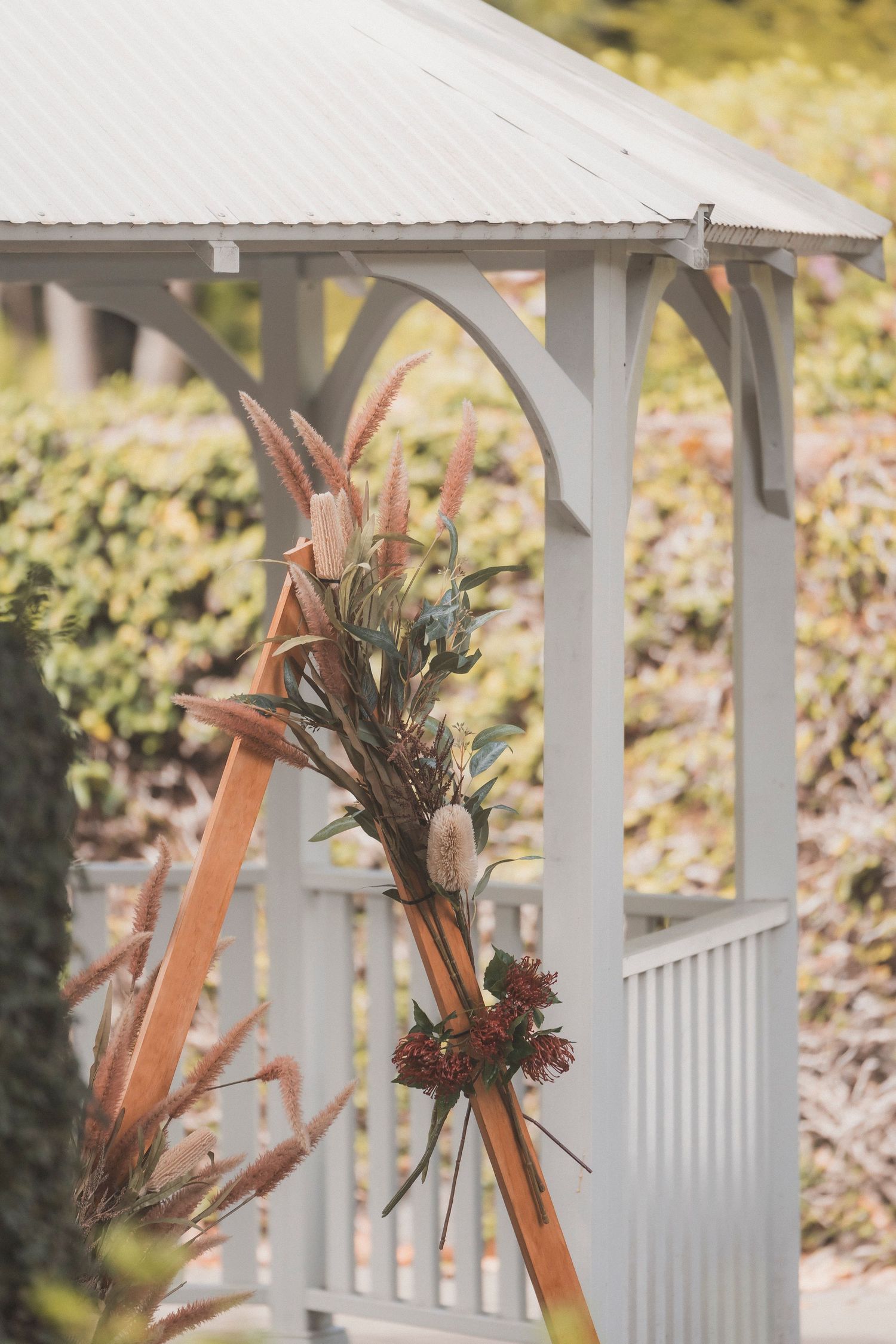 Floral setup and ceremony styling for a surprise vow renewal at Noosa Botanical Gardens, styled and photographed on the Sunshine Coast.