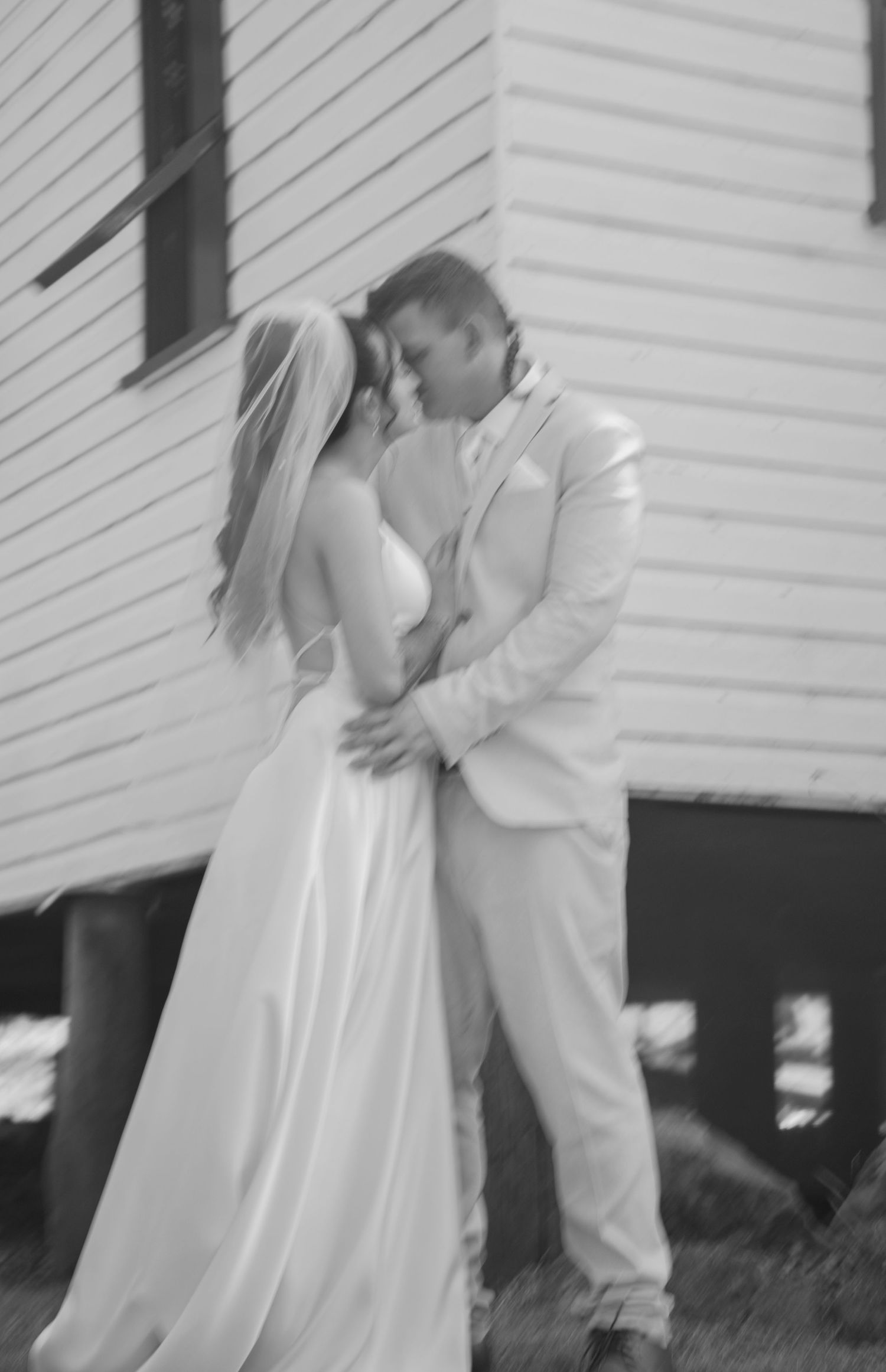 private moment out side chapel between bride and groom captured by documentary style photographer shae imagery in Minden, sommerset LOCKYER