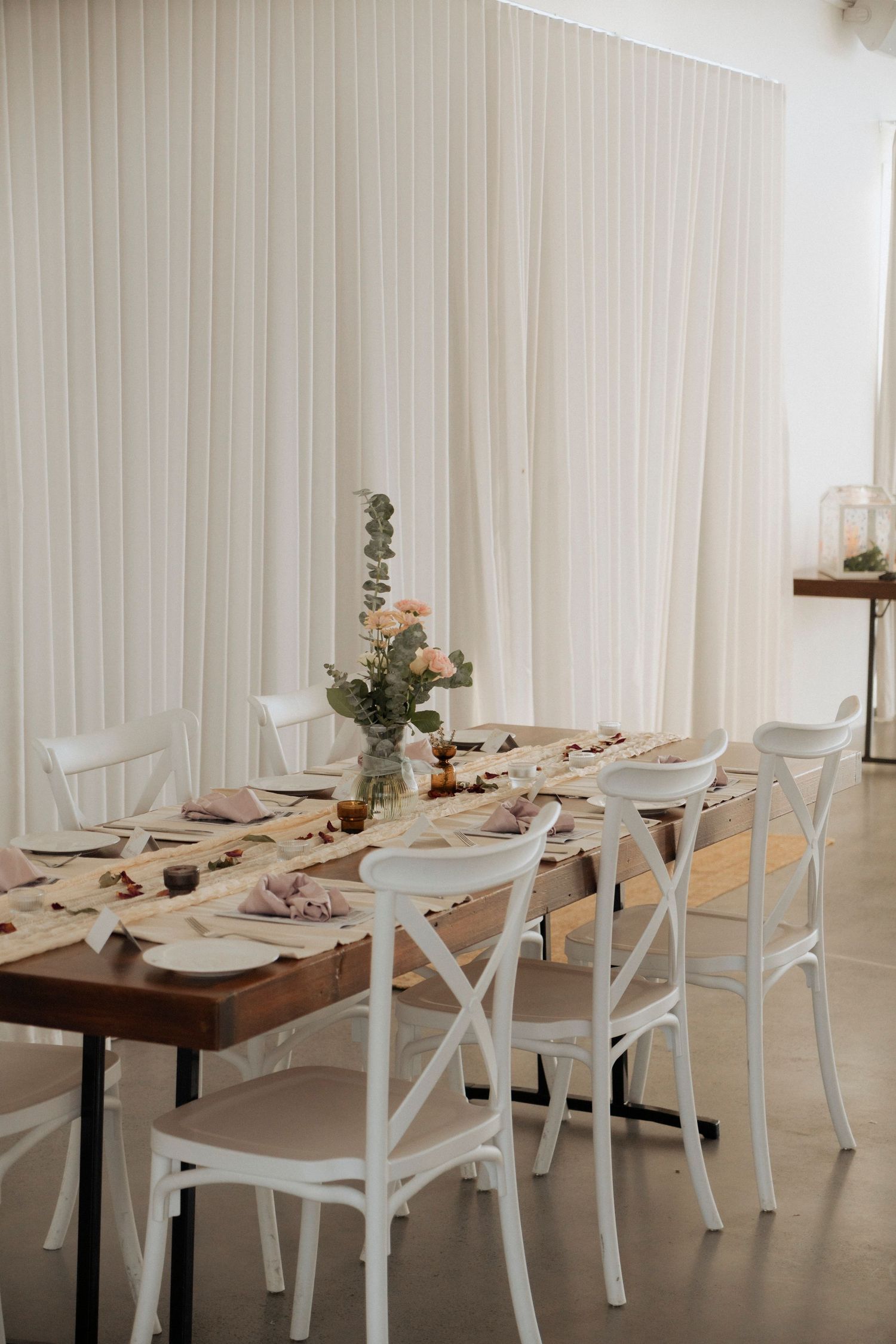 Wedding reception tables styled for an intimate celebration inside at Maroon Hill Estate.