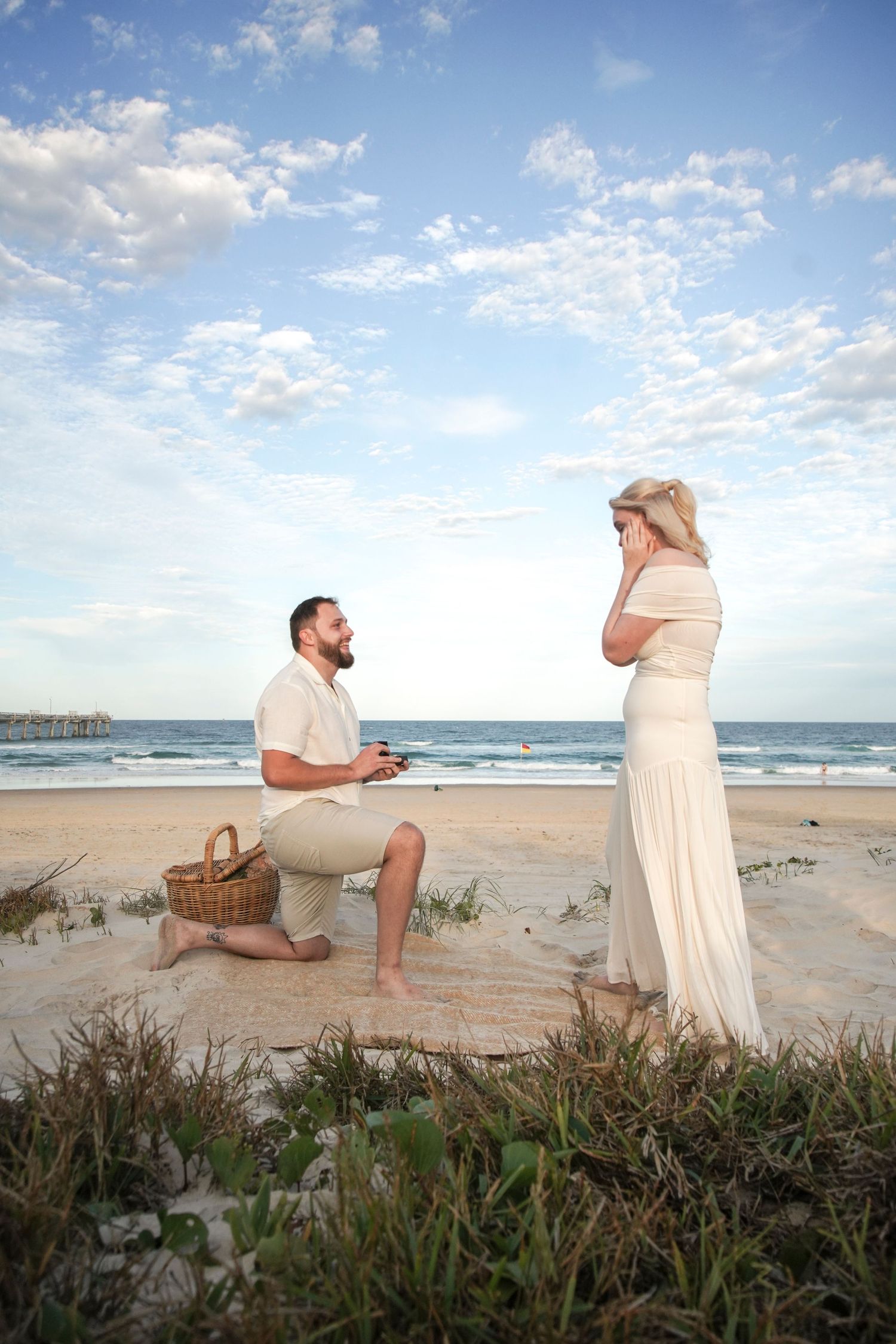Candid proposal photography with hidden photographer capturing reaction Beach proposal  Shae Imagery Lockyer Valley Gold Coast Photography