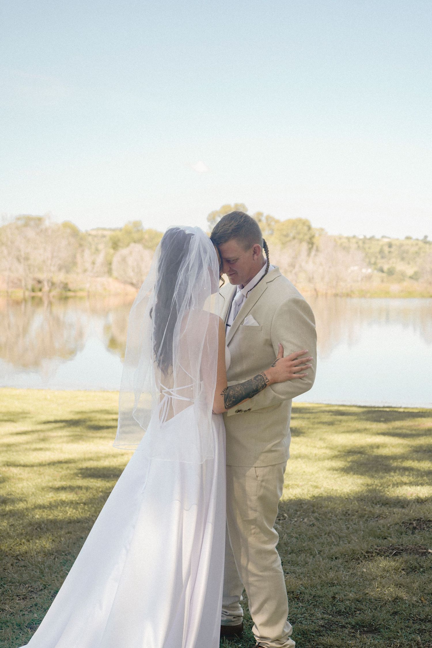 Bride and groom first look next to Lake Lockyer Valley Wedding. Photographed by Lockyer Valley Toowoomba, Ipswich wedding photographer