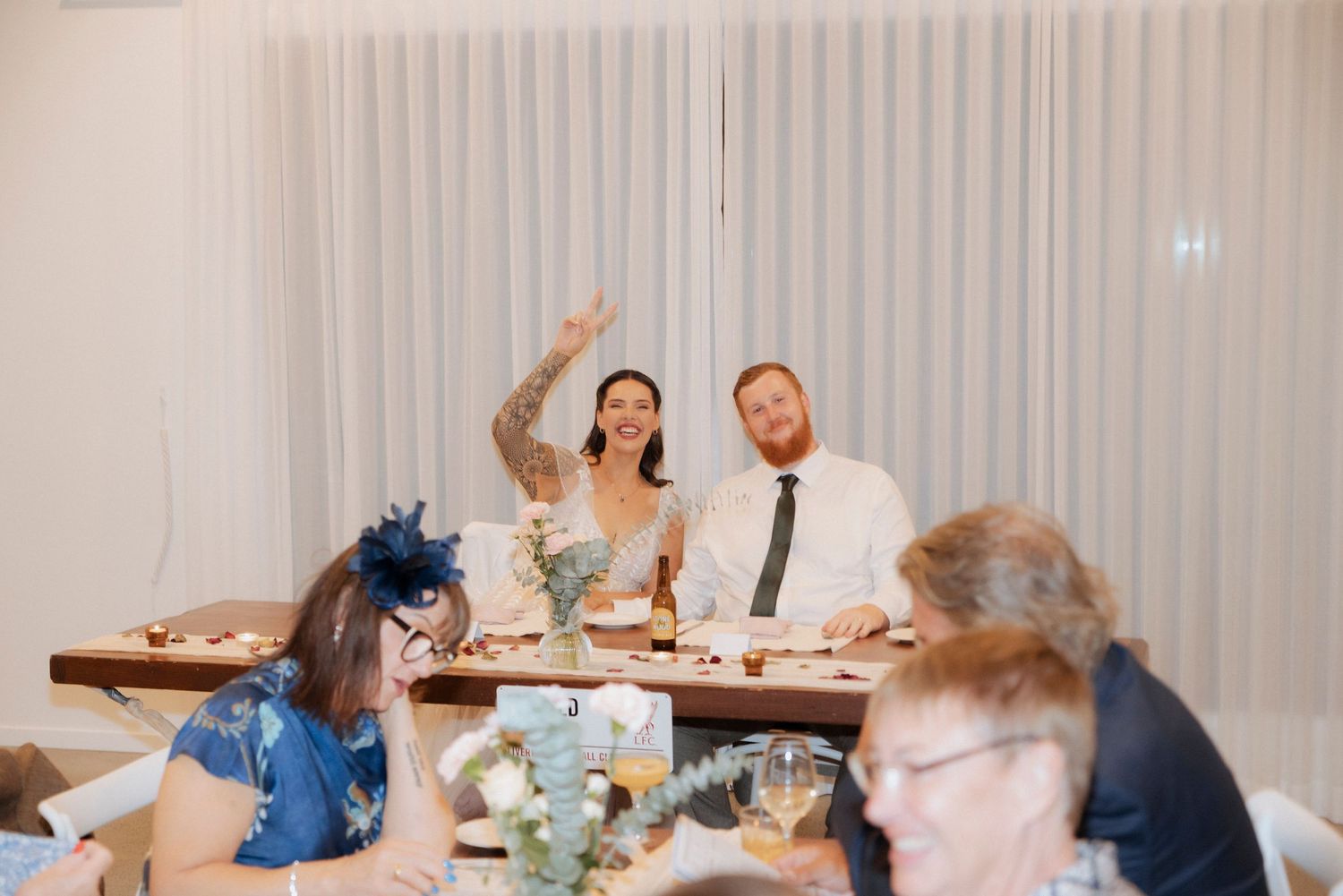Guests enjoying the reception inside the modern reception space at Maroon Hill Estate.