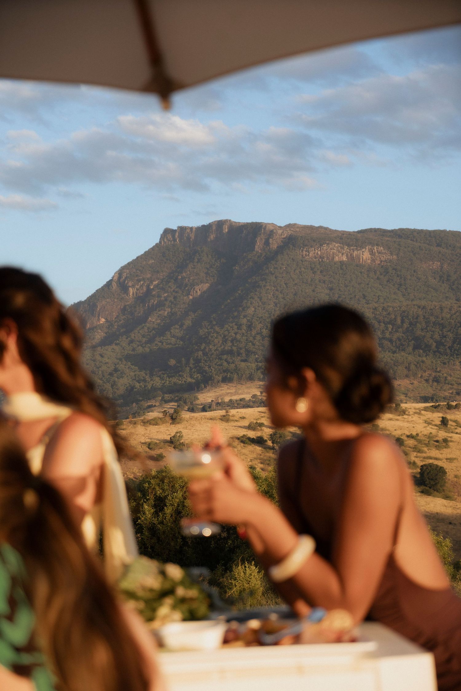 The best venue for wedding guests cocktail hour at DIY venue Maroon Hill estate with stunning views. Wedding photography by Shae Imagery