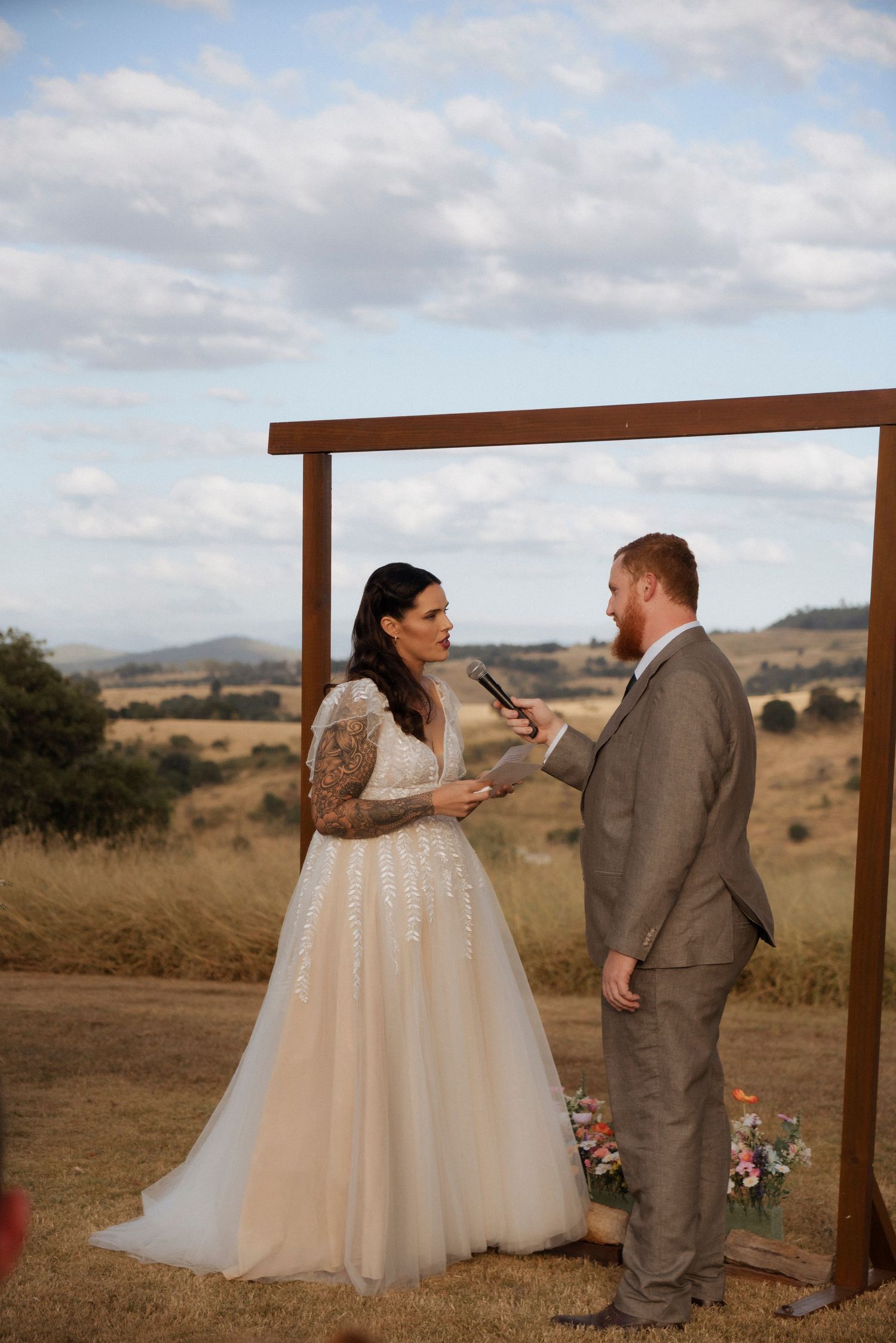Bride and Groom exchanging vows at Maroon Hill estate affordable but stunning wedding venue photographed by Shae Imagery