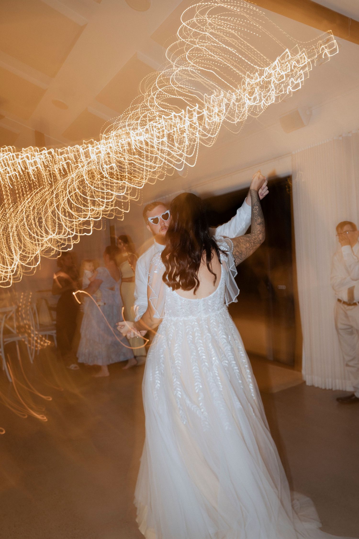 Direct flash photo of newlyweds dancing the night away at Maroon Hill Estate.