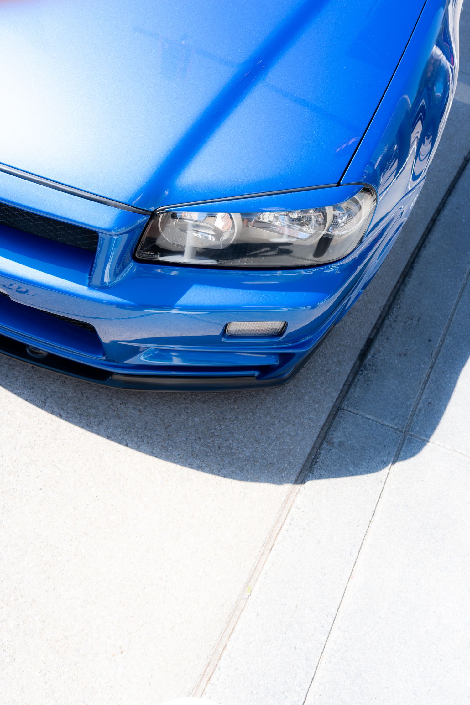 Clean side profile of a vehicle with strong horizontal lines and a minimal background.