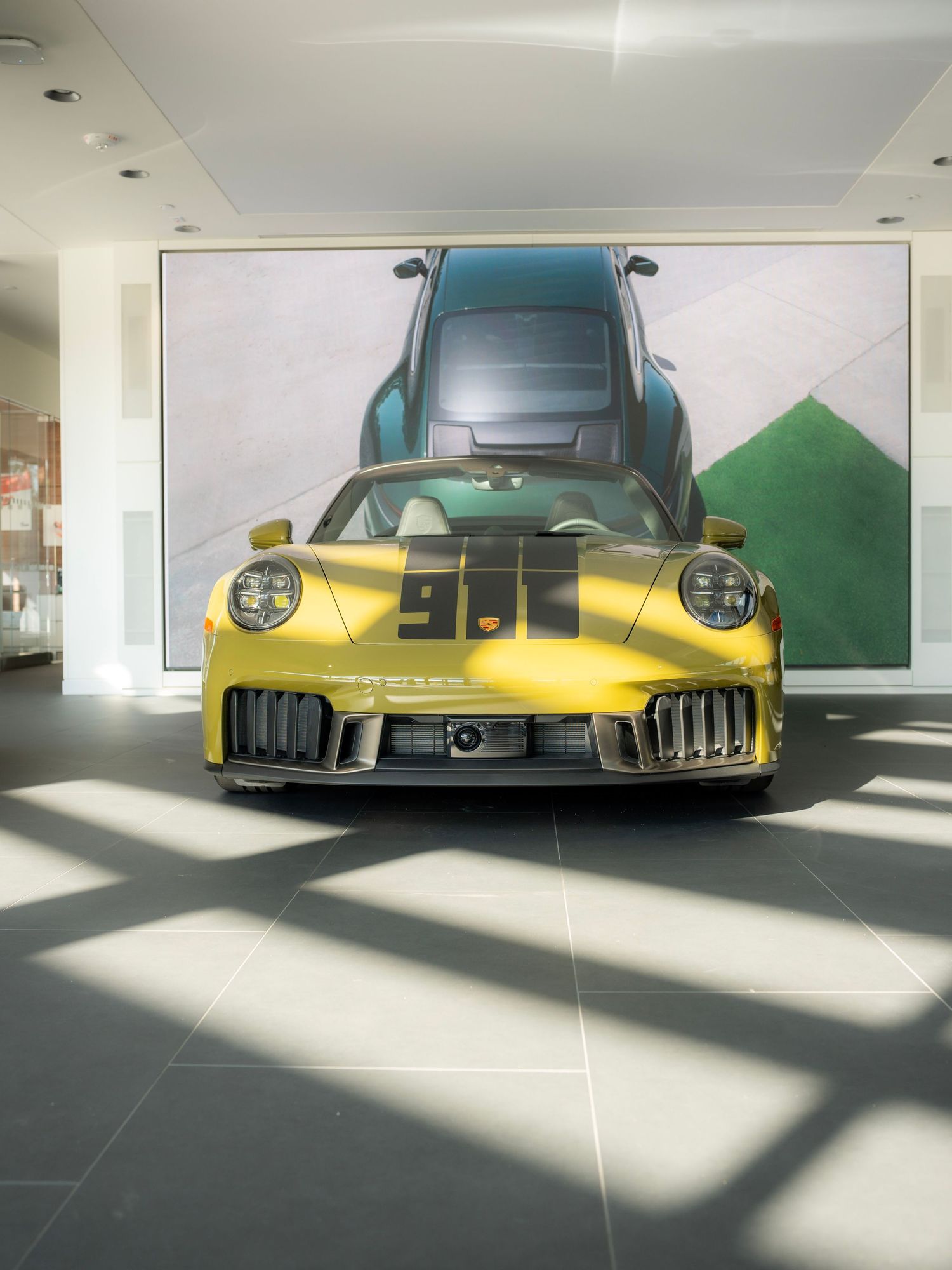 Wide shot of a luxury car in open space using negative space and soft natural light.