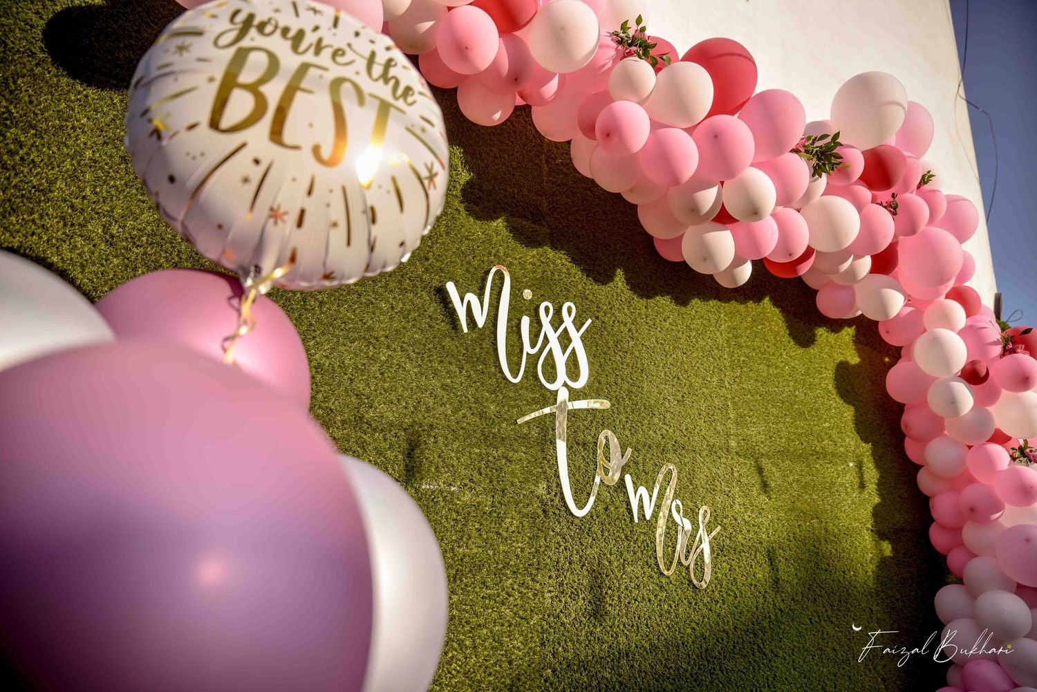 Miss to Mrs wedding sign with pink balloon arch and You're the Best foil balloon.