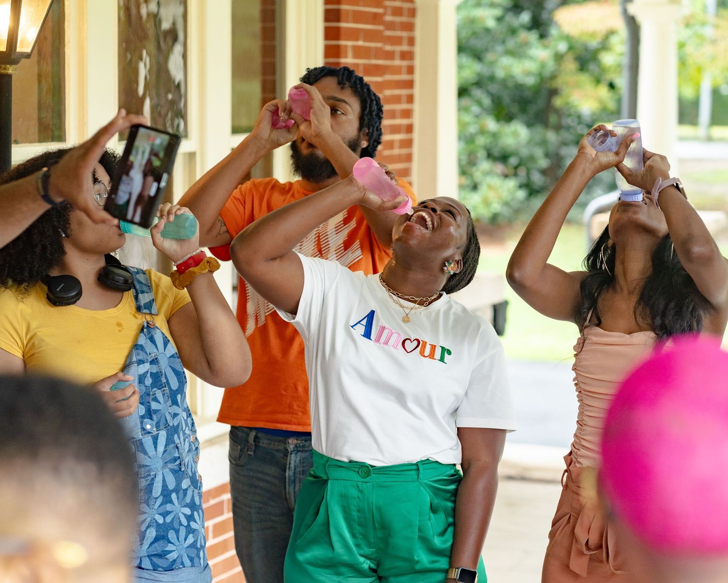 A lively group of friends play baby shower games in Atlanta, GA