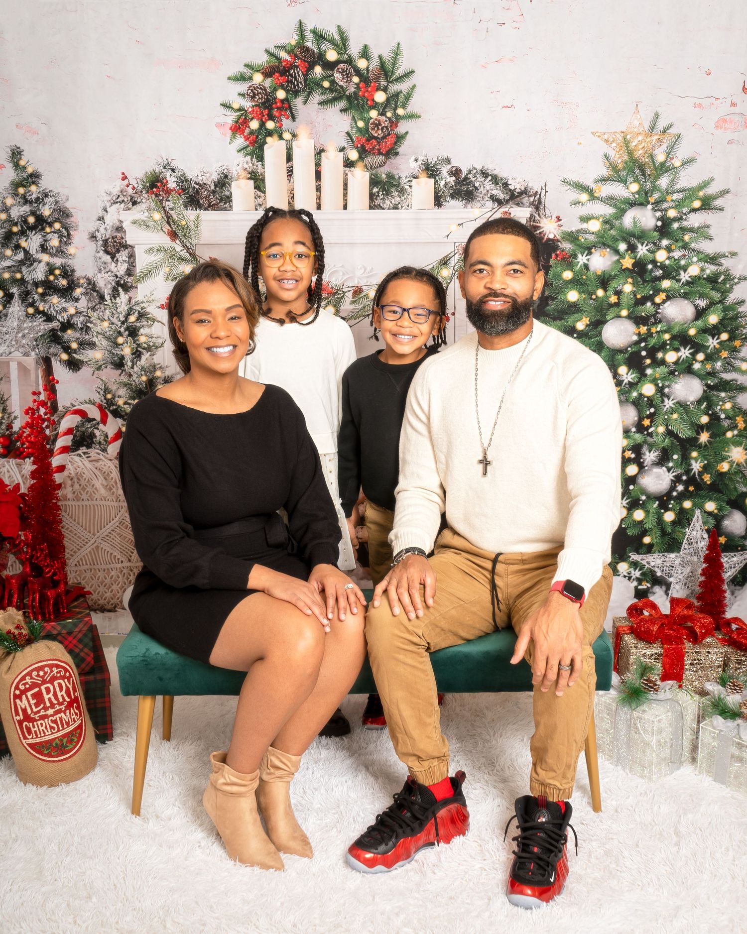 Christmas family portrait in Smyrna, Georgia — smiling family dressed in warm tones surrounded by festive holiday décor.