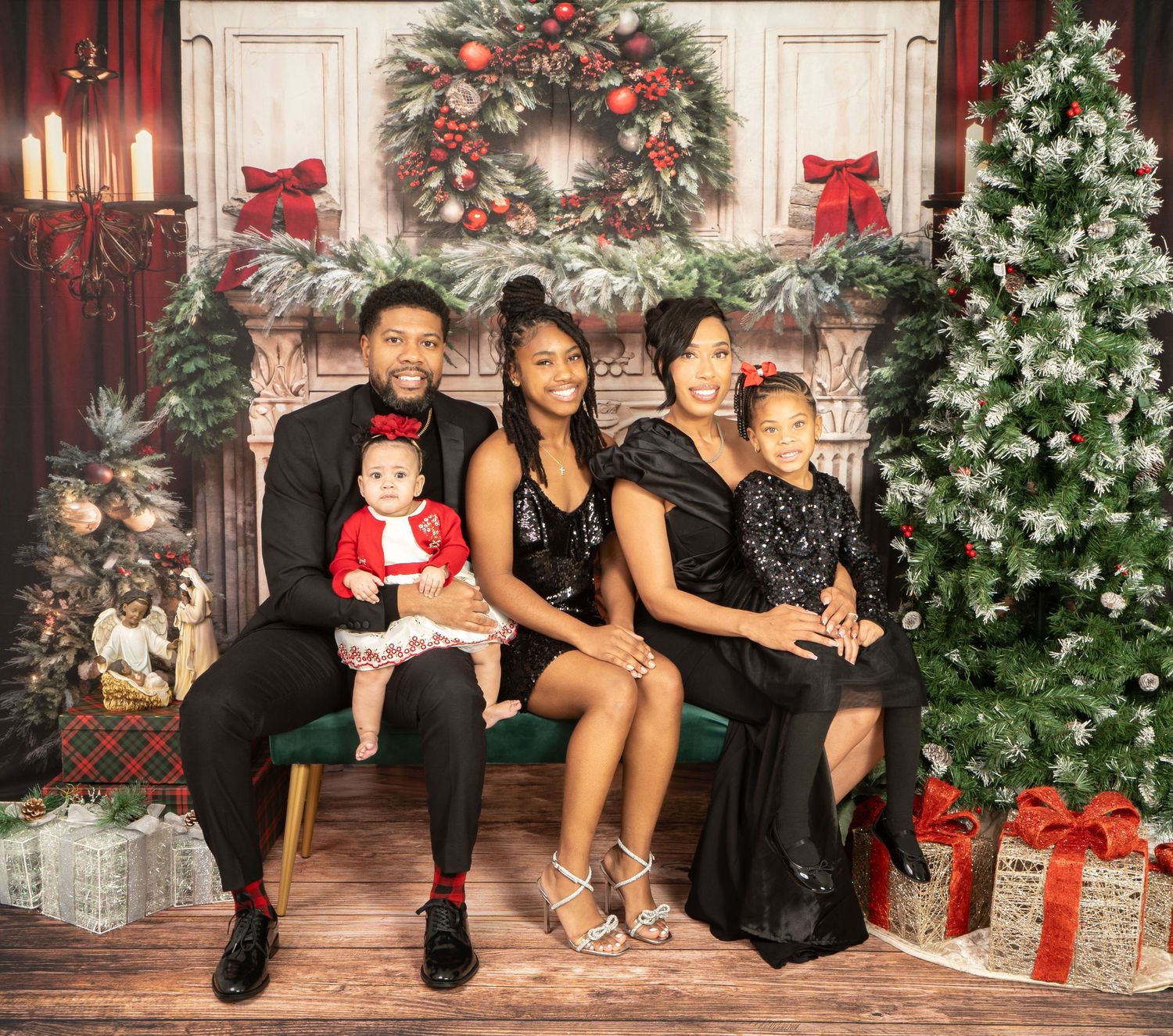 Family of five smiling during Christmas mini session by Murray Vision Photography in Atlanta.