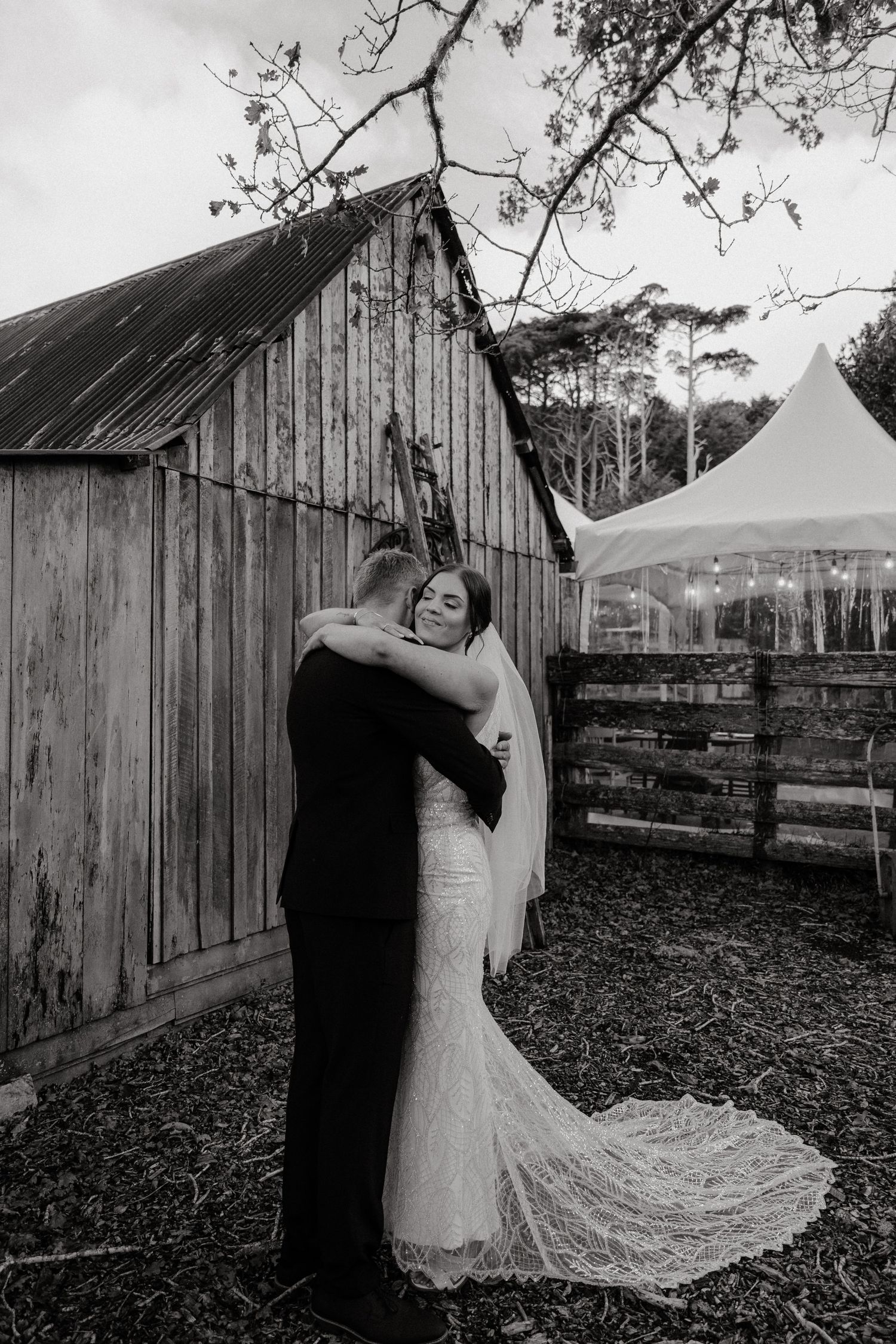 A romantic black and white photo sequence shows a couple dancing together near a rustic wooden barn.