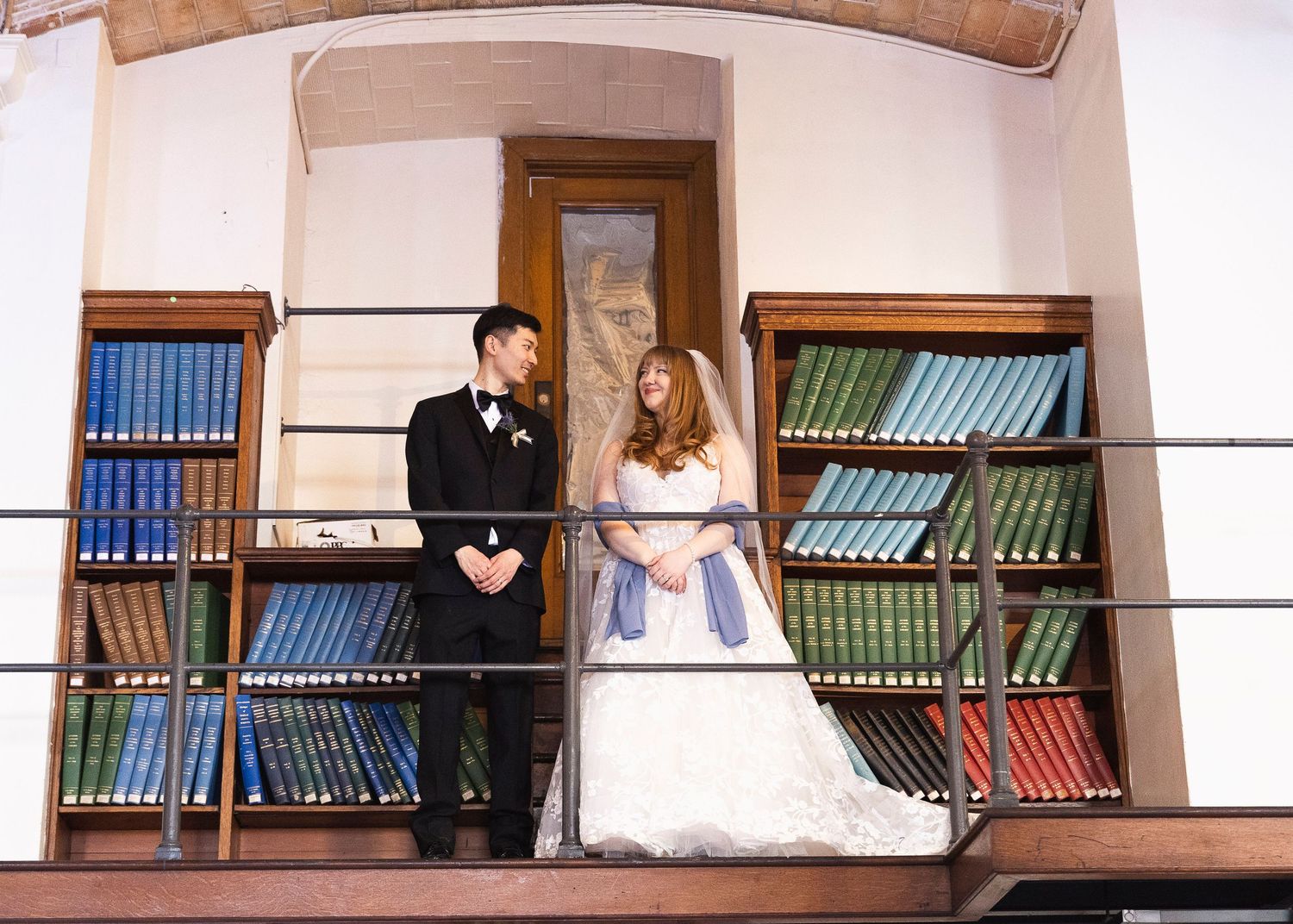 Intimate wedding ceremony in the Guastavino Room at the Boston Public Library with bright winter light.