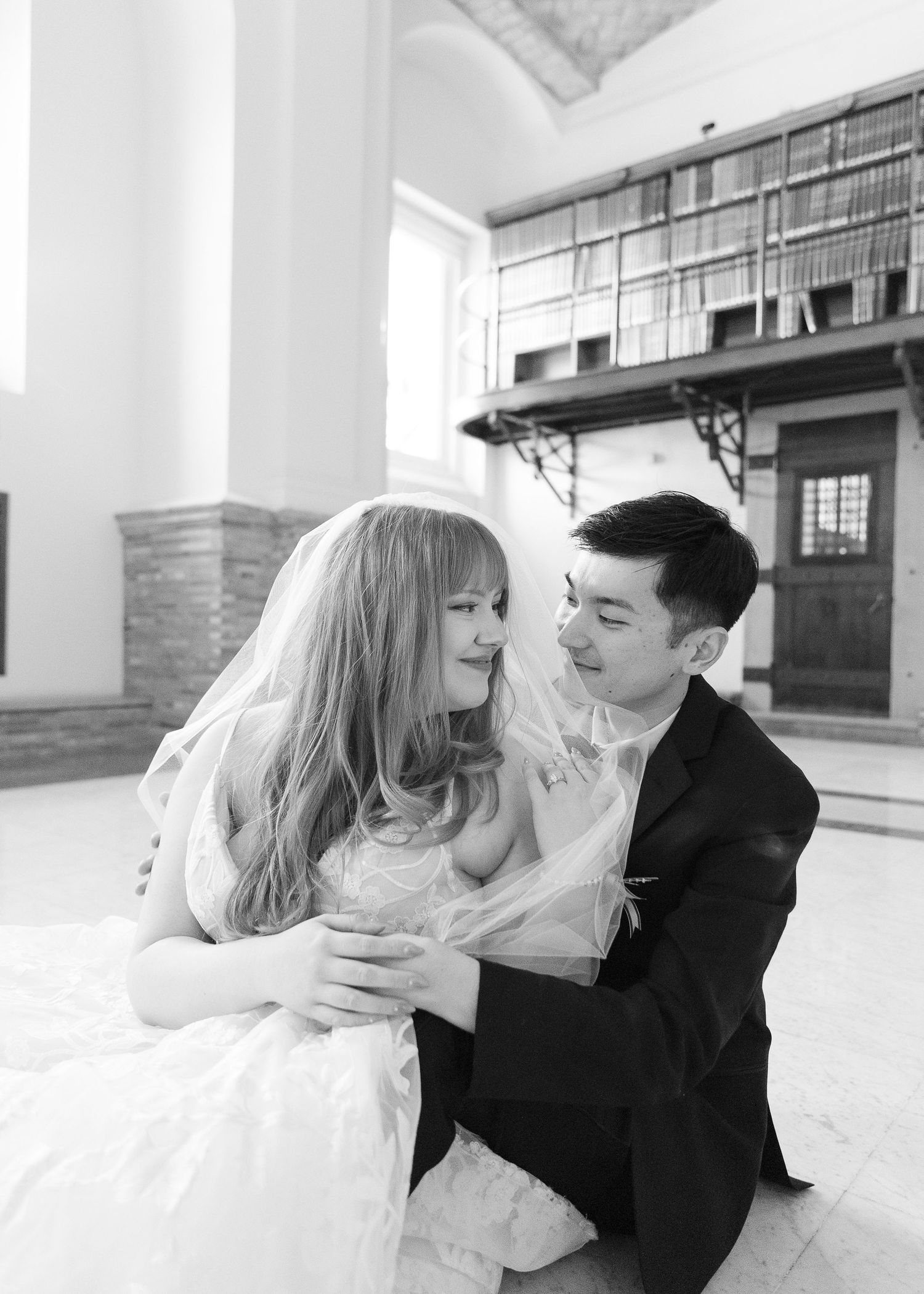 omantic wedding portraits of a couple tucked away in the historic book stacks of the Boston Public Library.
