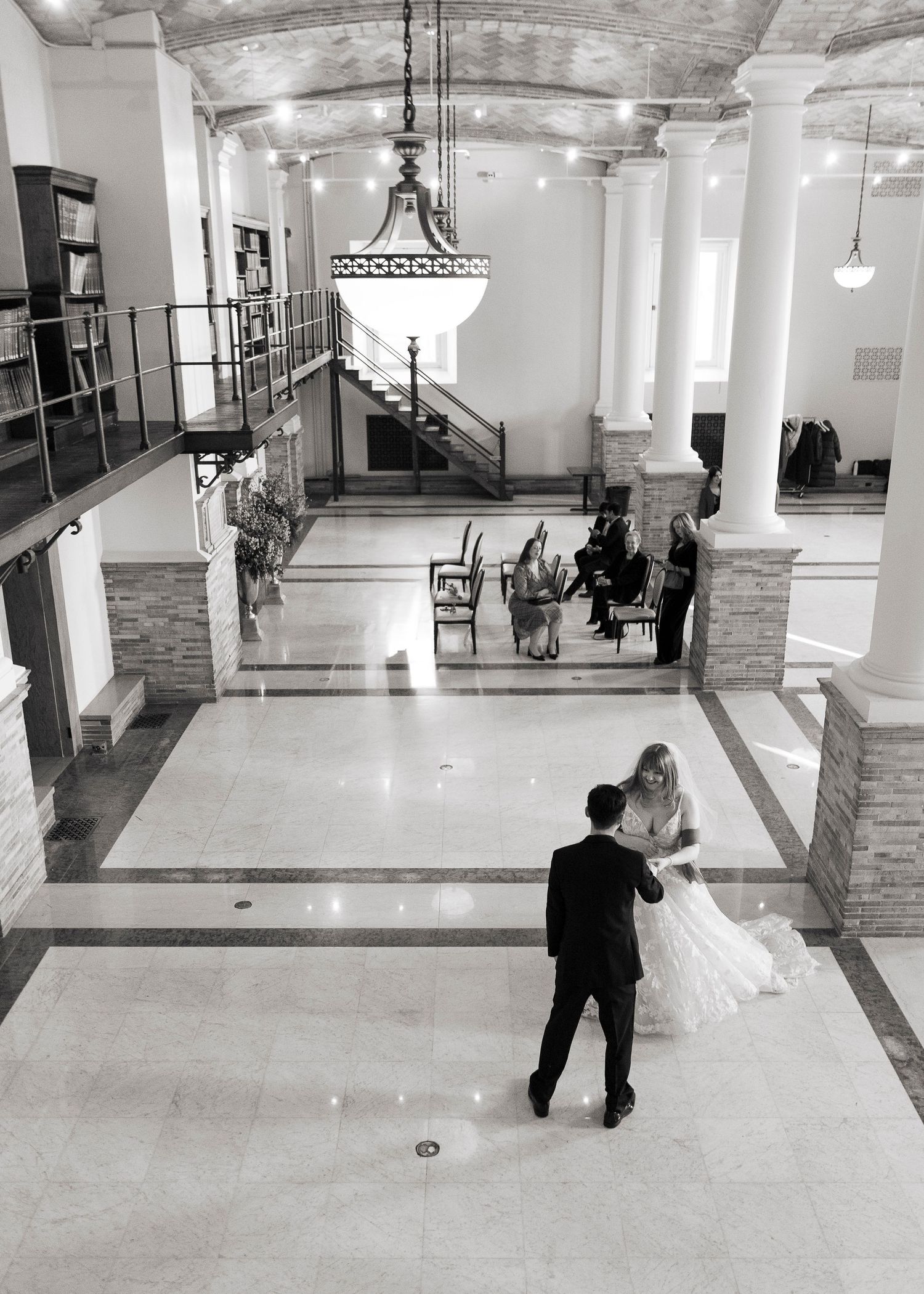 Romantic wedding portraits of a couple tucked away in the historic book stacks of the Boston Public Library.