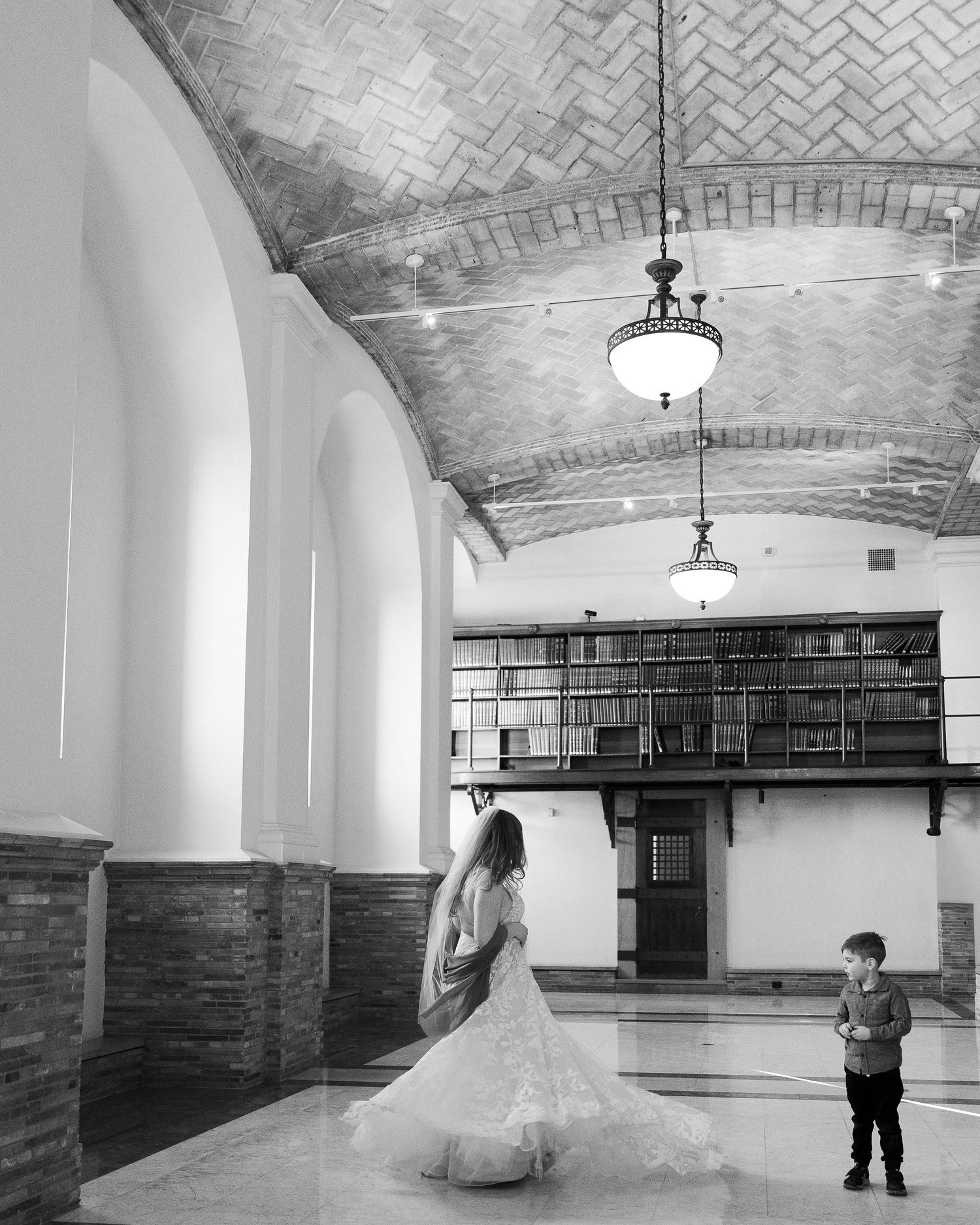Romantic wedding portraits of a couple tucked away in the historic book stacks of the Boston Public Library.
