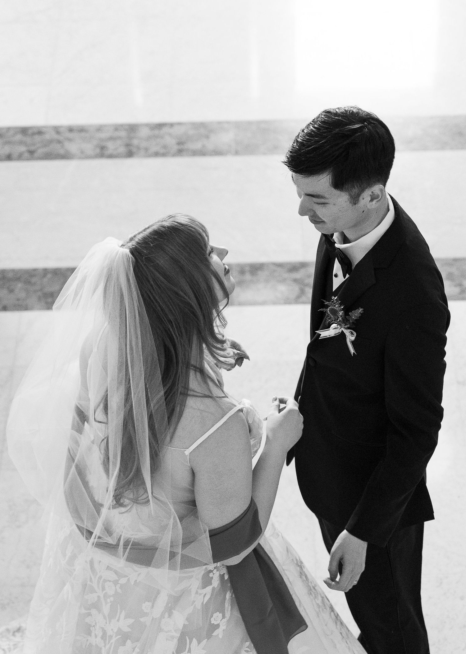 Intimate wedding ceremony in the Guastavino Room at the Boston Public Library with bright winter light.