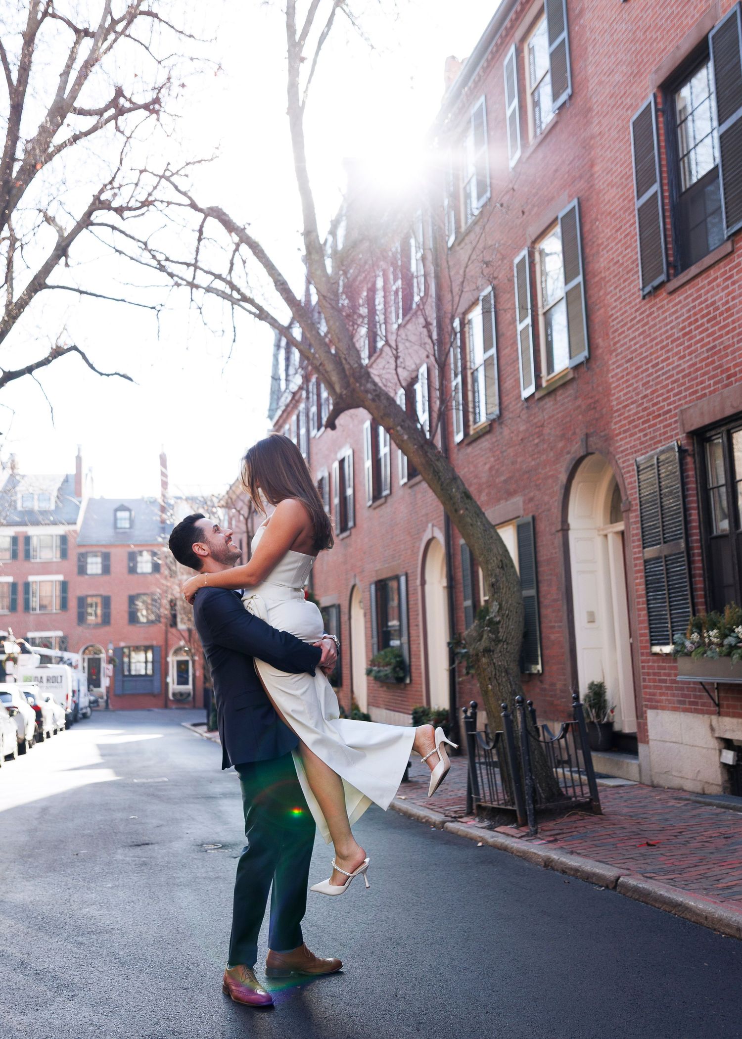 A sequence of dance movements performed on a brick-lined street in Boston's historic Beacon Hill neighborhood.