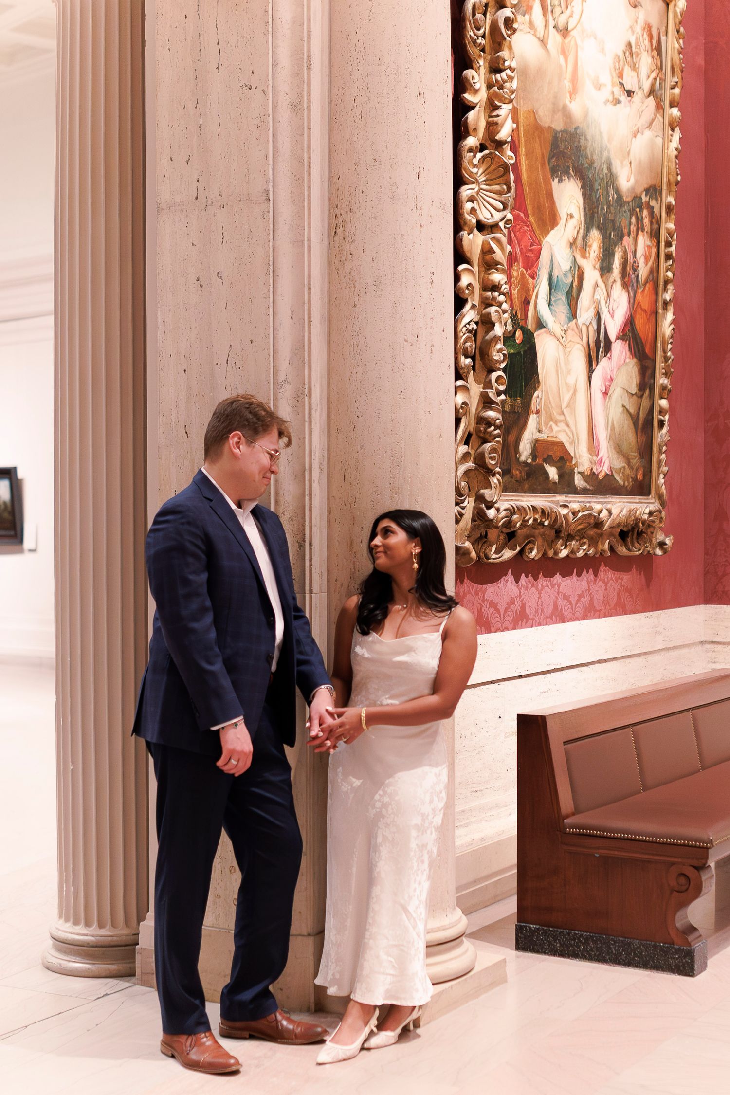A sequence of photos showing a couple in formal attire posing against a white column in a museum or gallery setting.