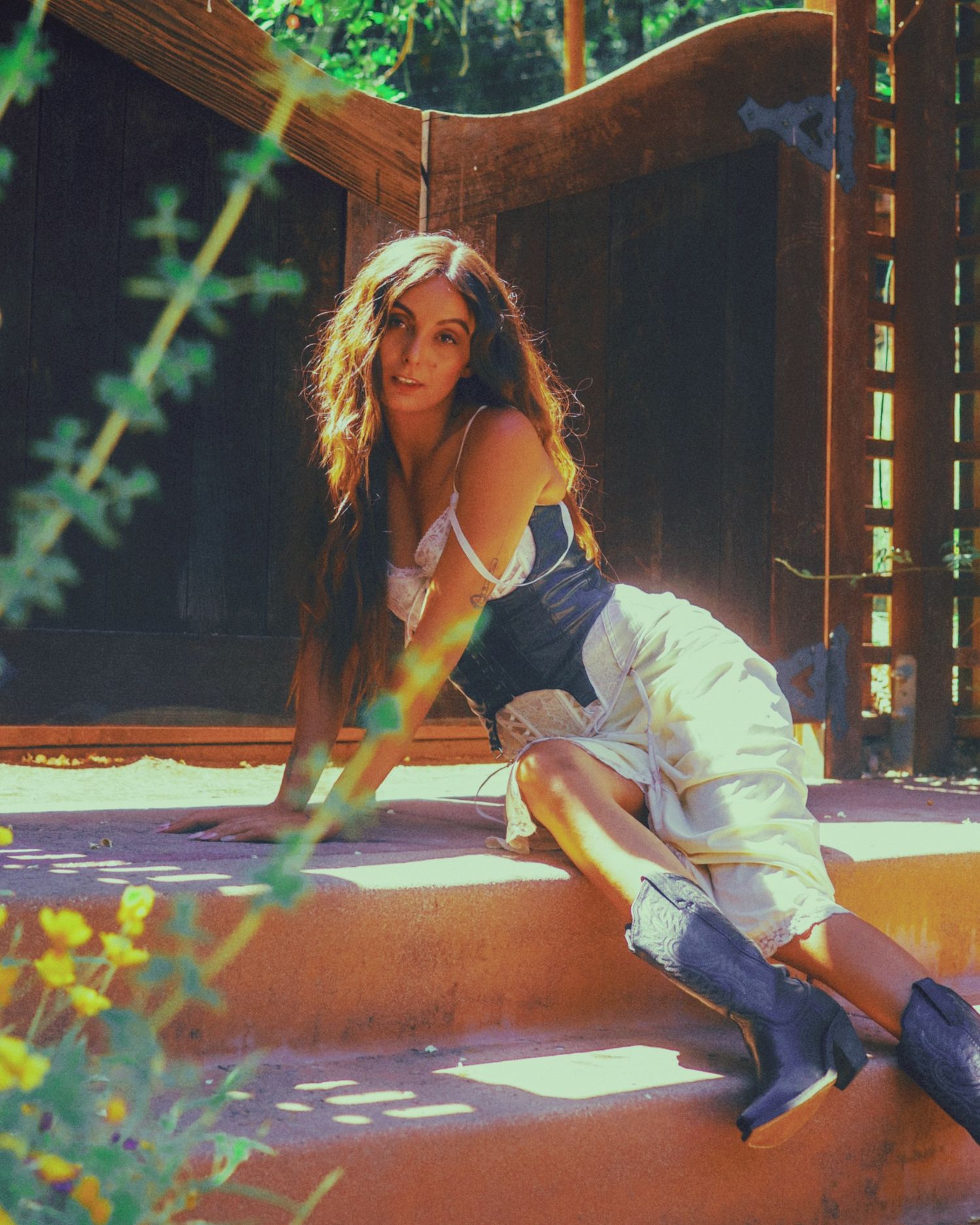 Sunlit outdoor portrait series on wooden deck with dappled lighting.