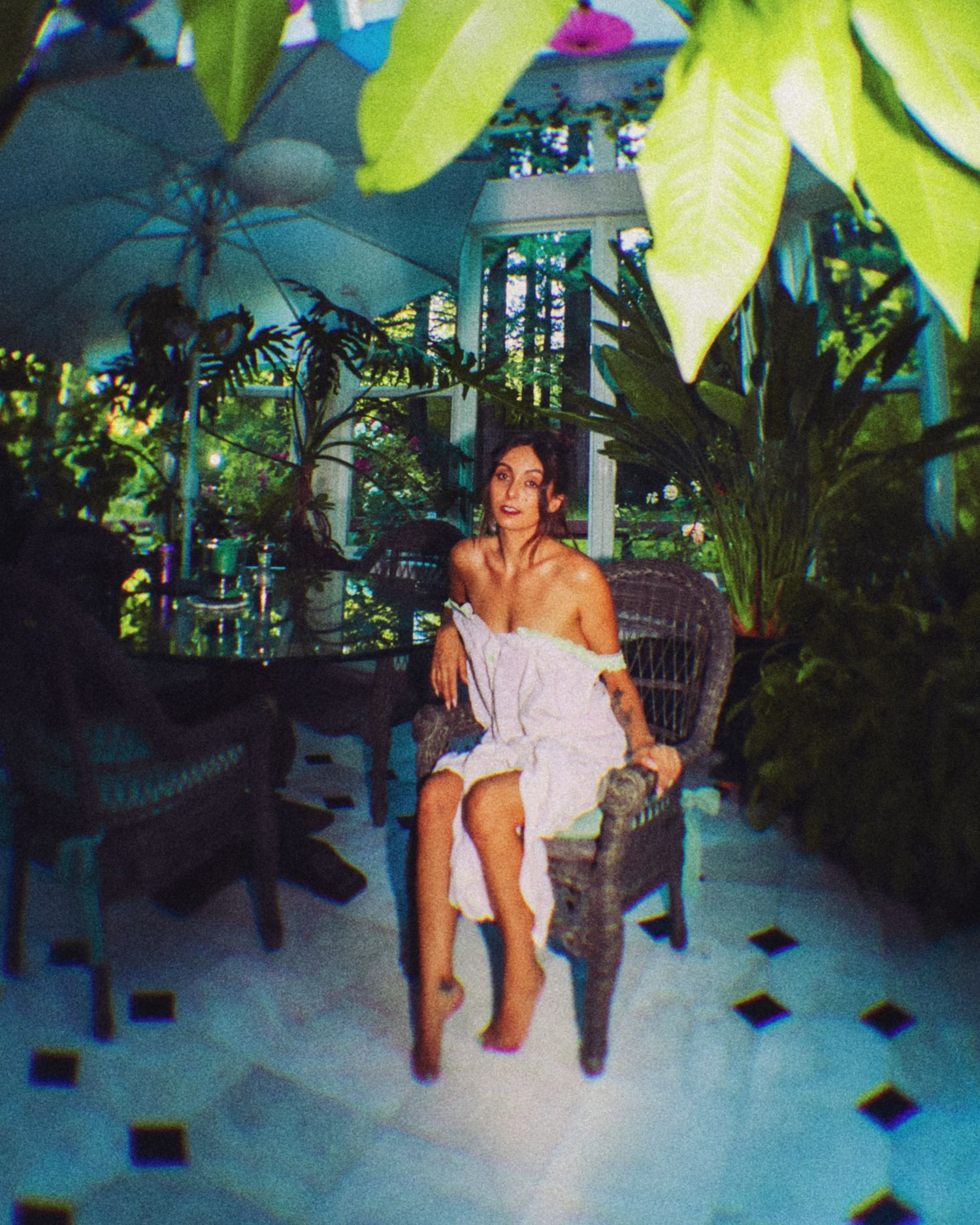 Artistic photos in a tropical setting with lush green plants and ambient lighting.