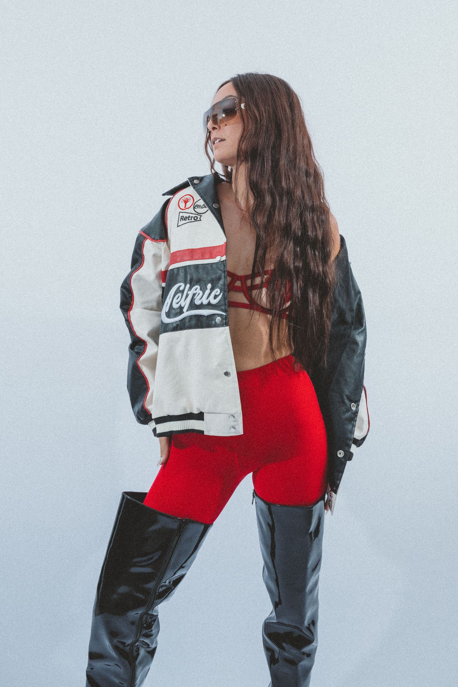 Athletic fashion shoot featuring red and black sportswear with dynamic poses.
