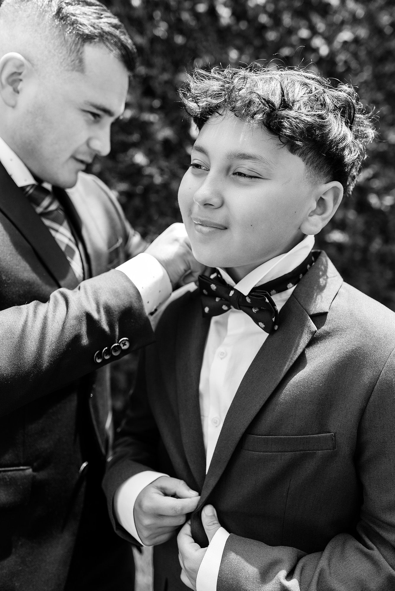 A series of black and white photos showing two people in formal attire sharing a tender moment outdoors.