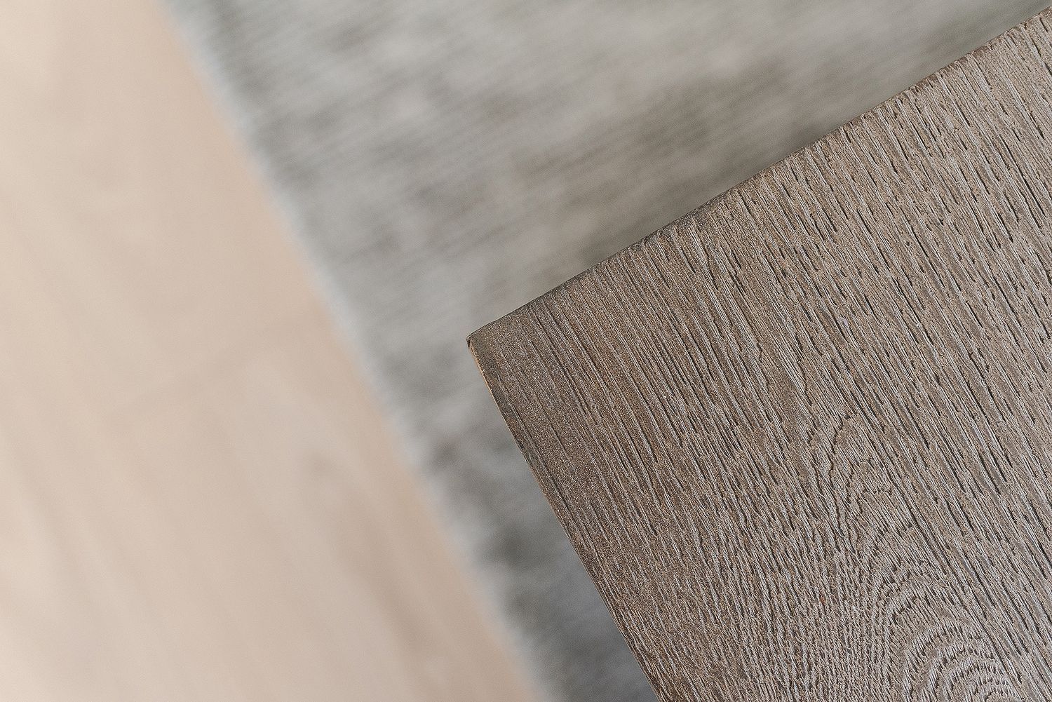 Close-up view of wood grain texture showing natural brown patterns and lines in timber surface.