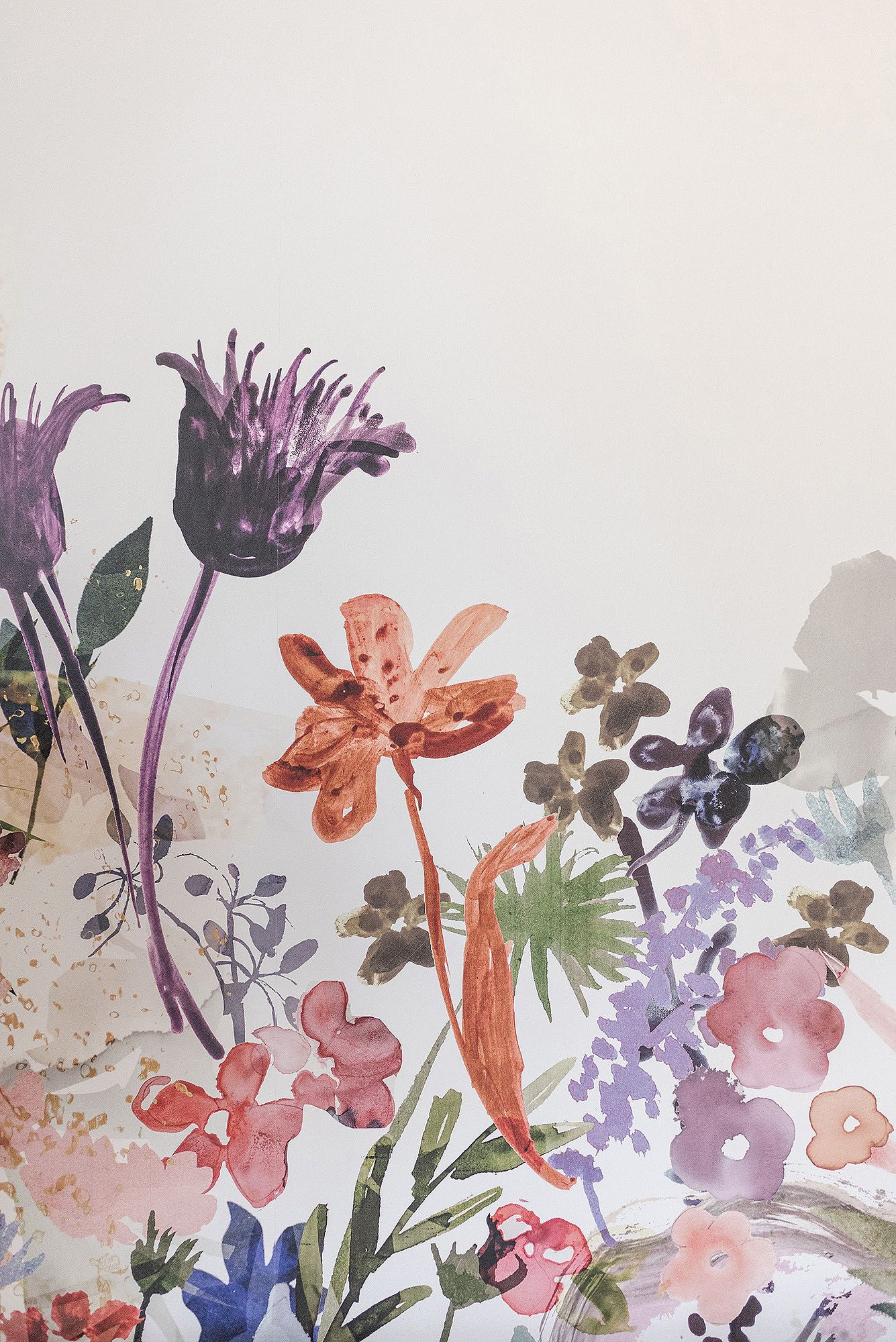 Watercolor-style floral wallpaper featuring purple, coral, and blue flowers on a light background.