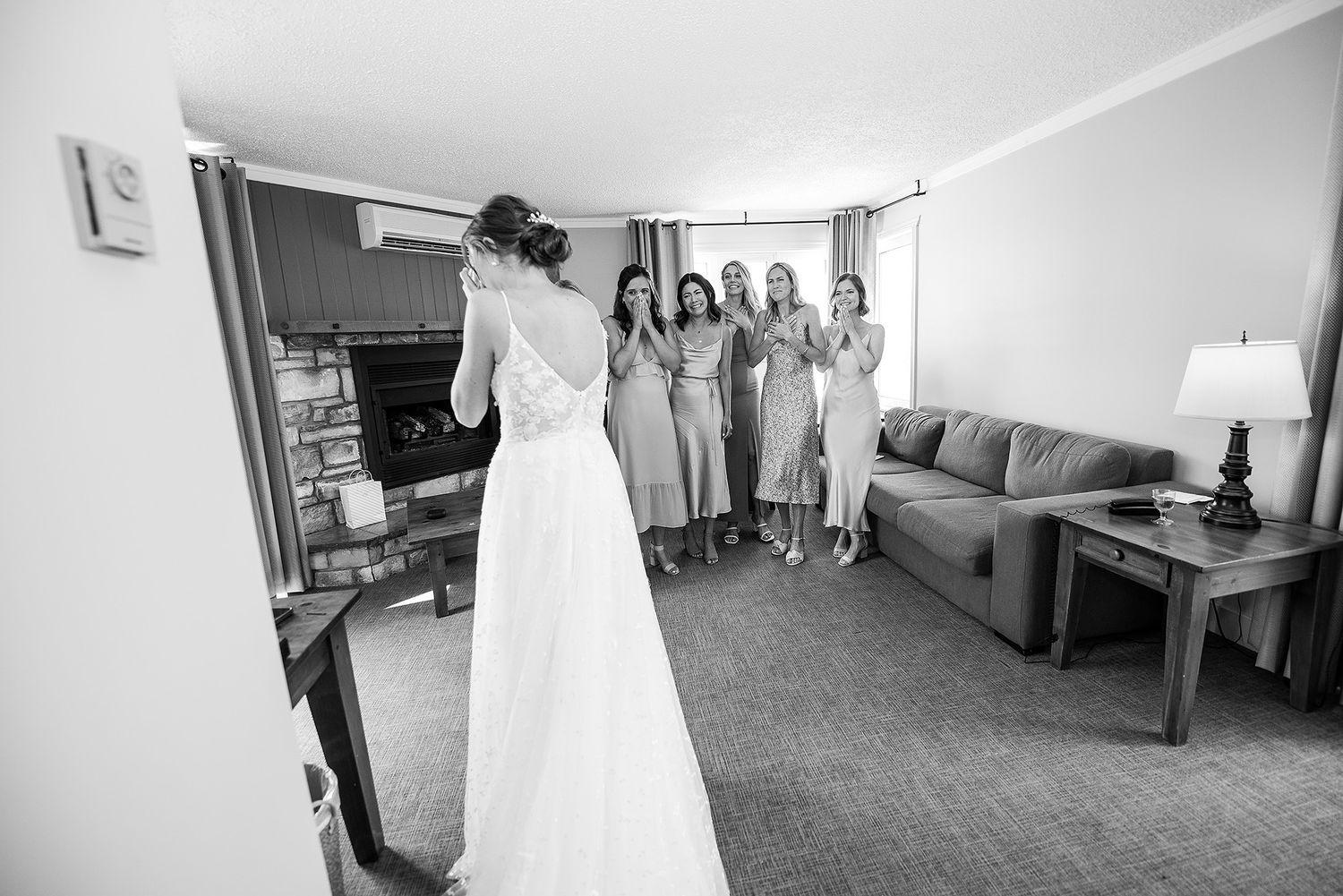 A series of black and white wedding preparation photos showing details of the dress, venue, and bridal party.