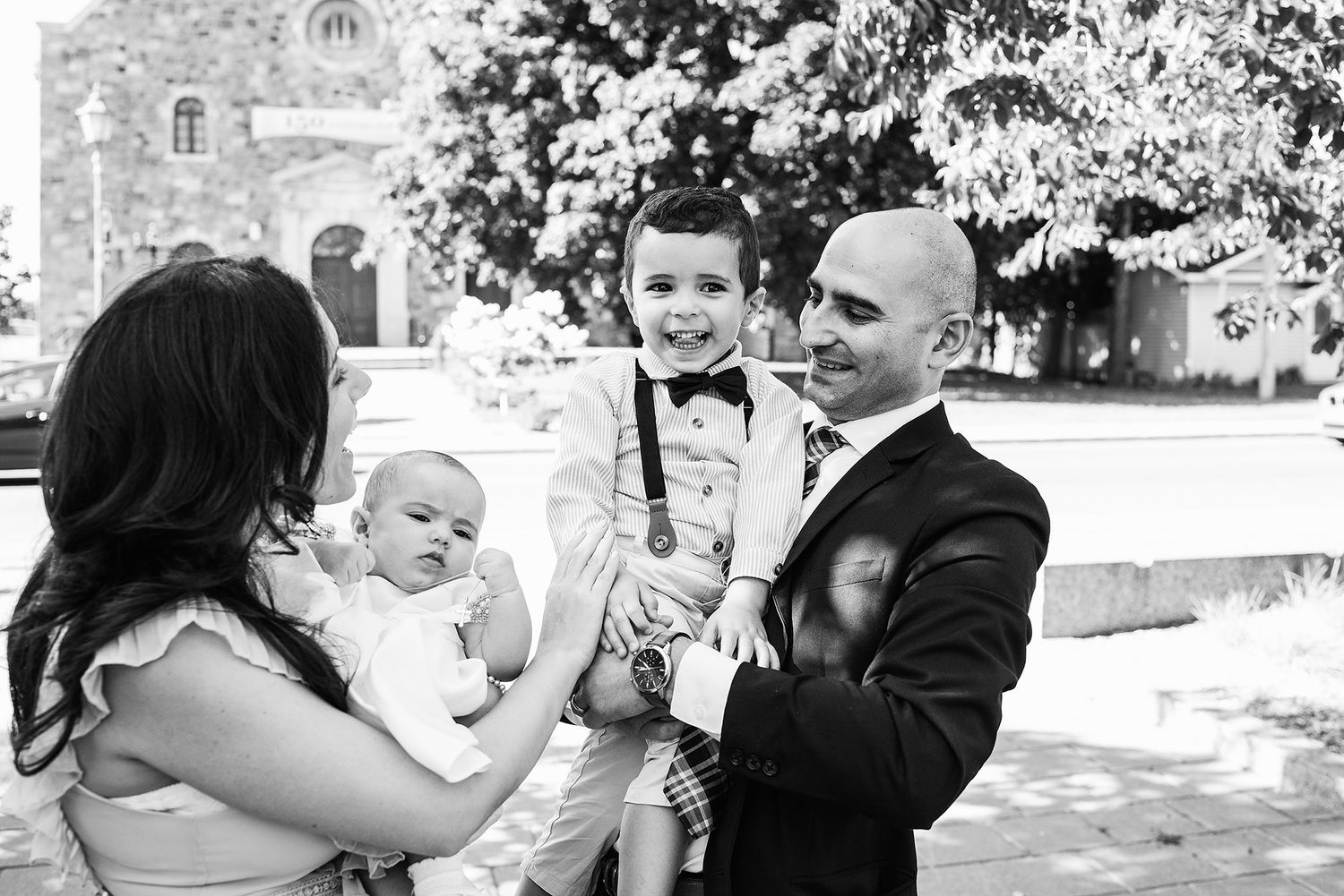 Black and white photo of a joyful celebration outdoors.