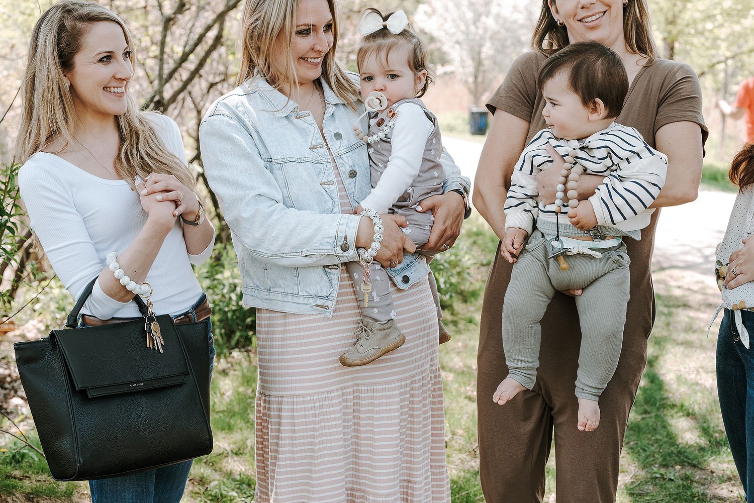 Lifestyle photo series showing a gray camouflage diaper bag being demonstrated outdoors.