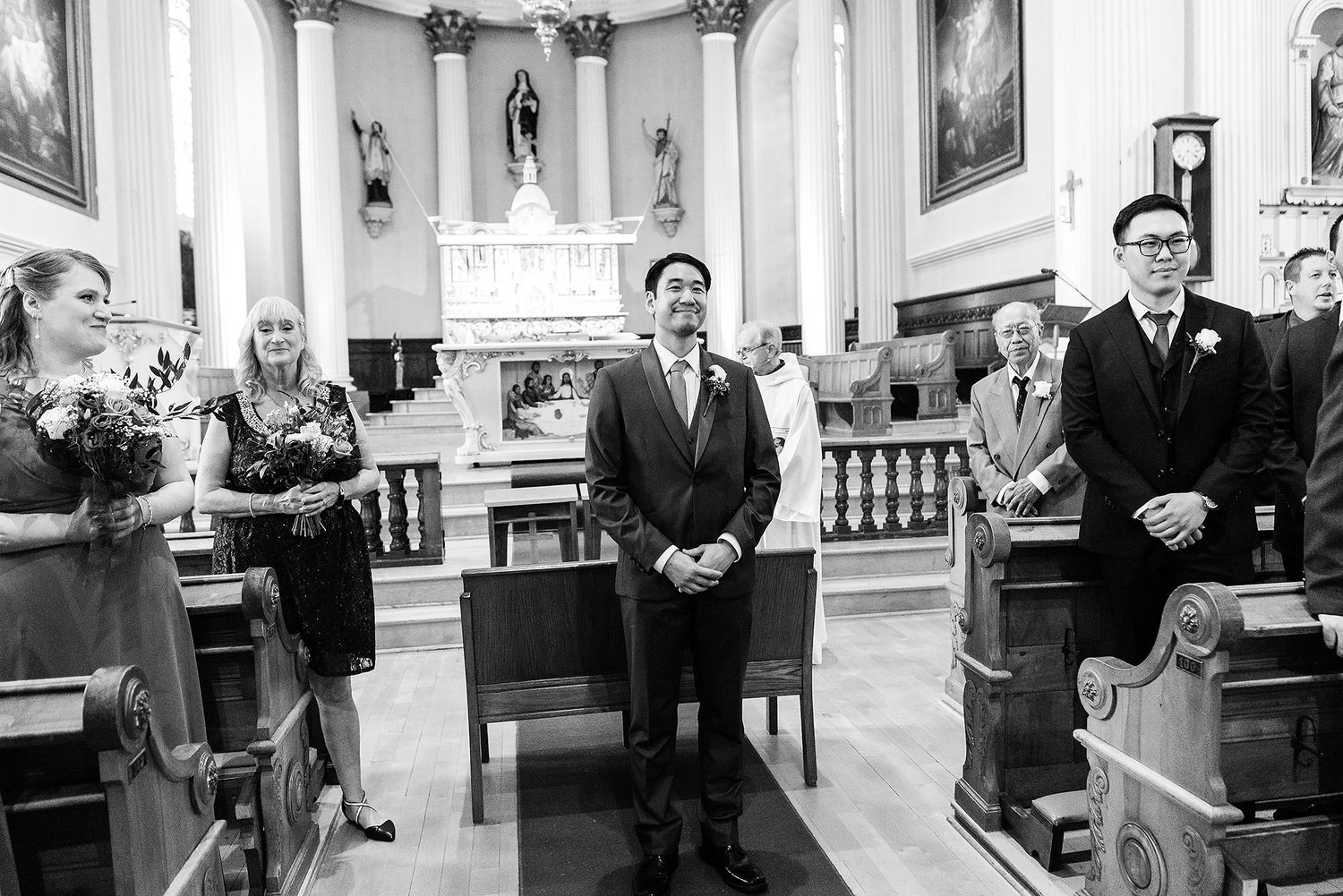 Emotional wedding ceremony moments captured in a series of black and white photos inside an elegant church setting.