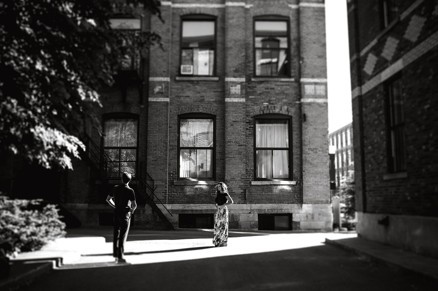 Exterior view of historic brick apartment buildings with classic windows and architecture.