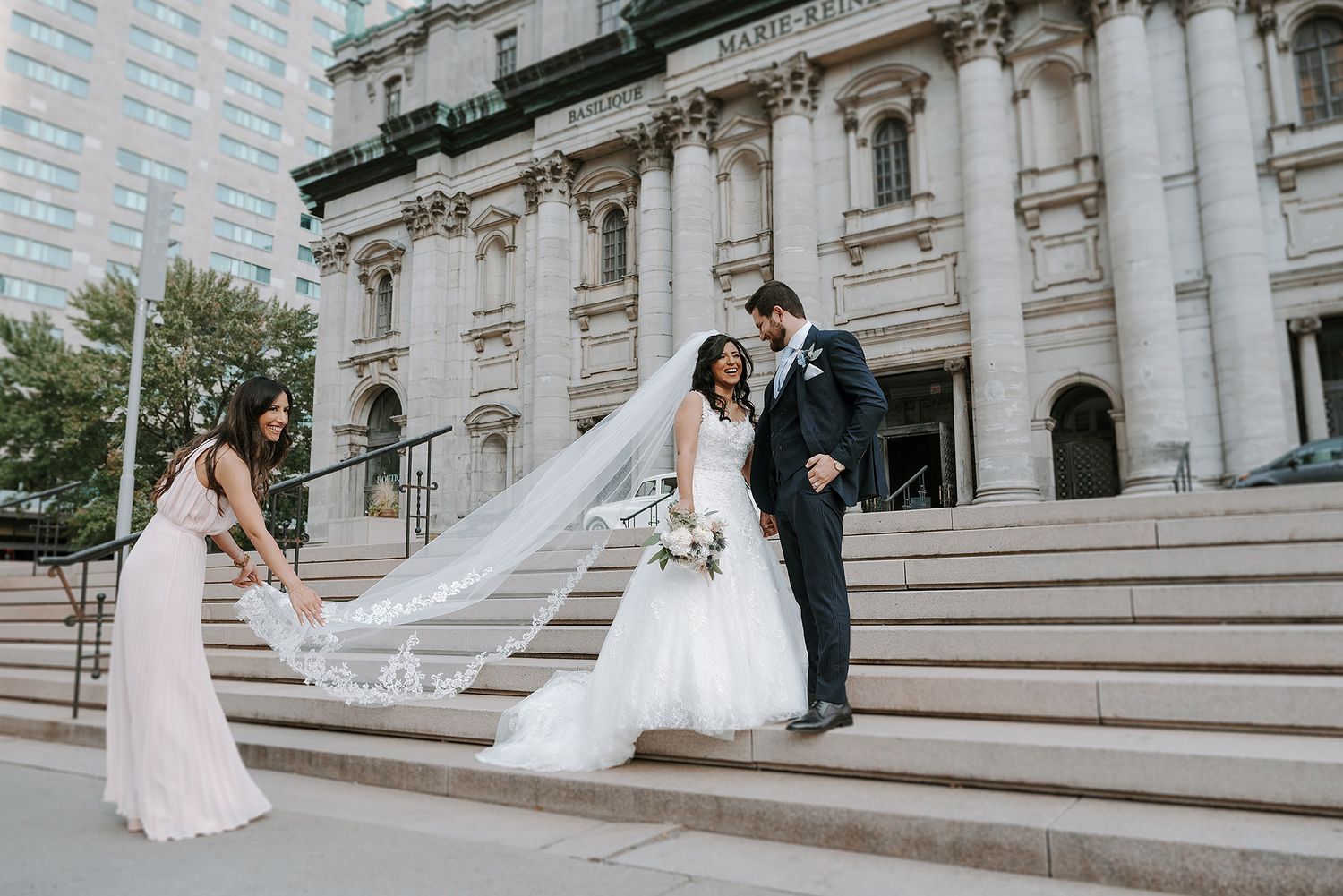 Five sequential wedding photos showing a couple posing on grand stone steps of a classical building.