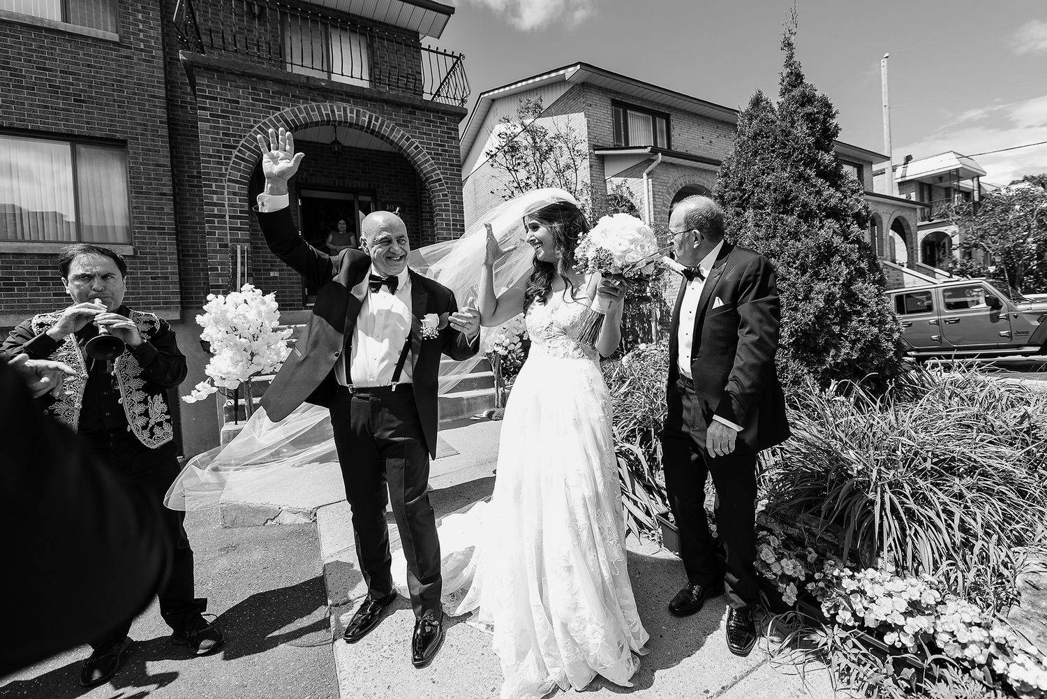 A collection of black and white wedding photos showing joyful moments outside a brick church building.