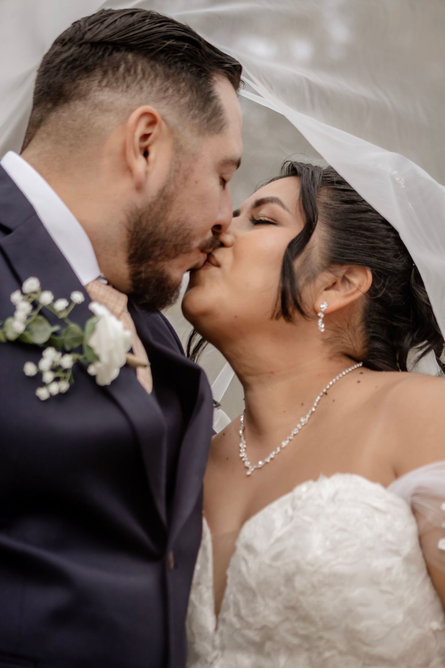 A romantic sequence of wedding photos showing a couple sharing tender kisses in formal attire.